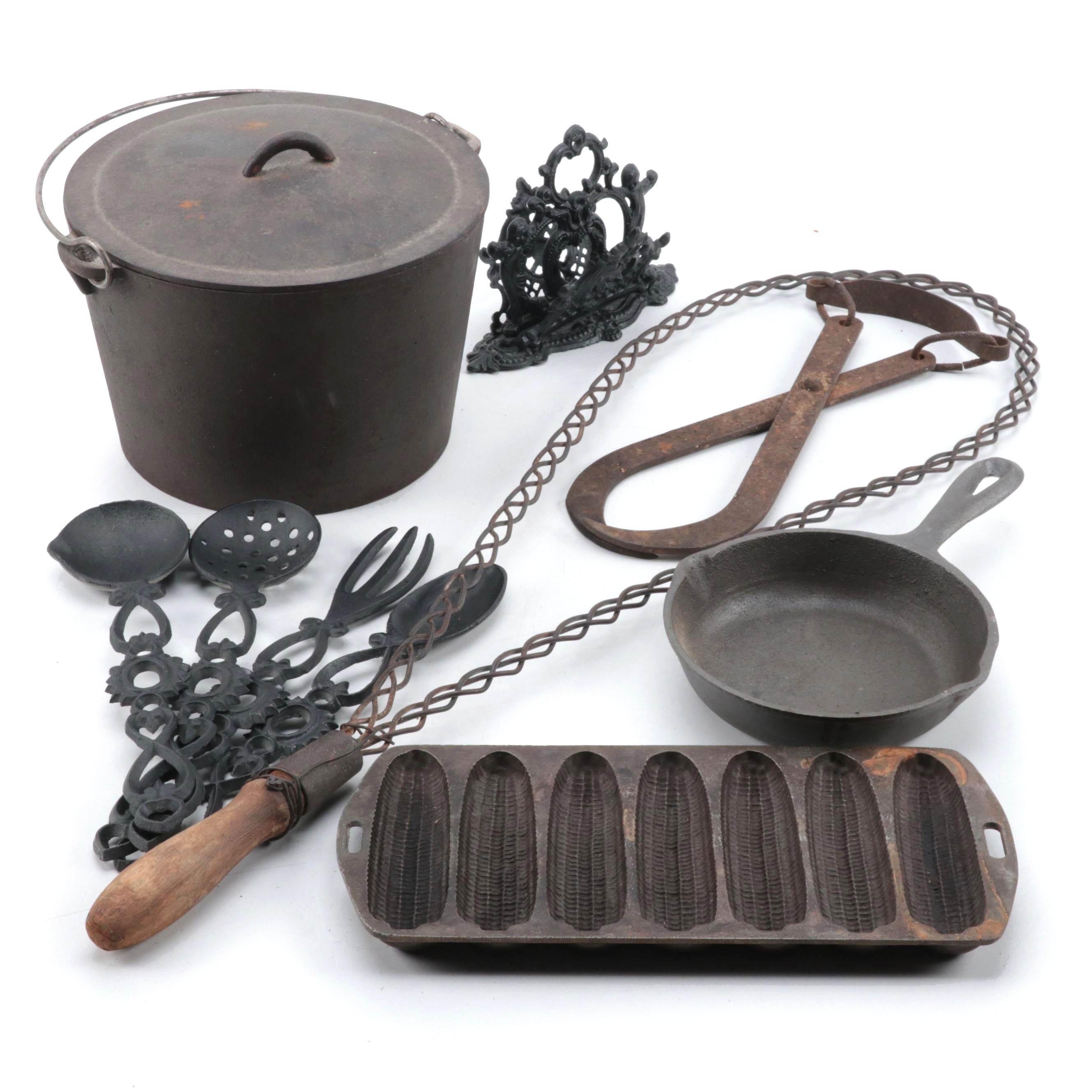 Cast Iron Lidded Pot, Cornbread Pan, Skillet, Rug Beater, Ice Tongs, and More