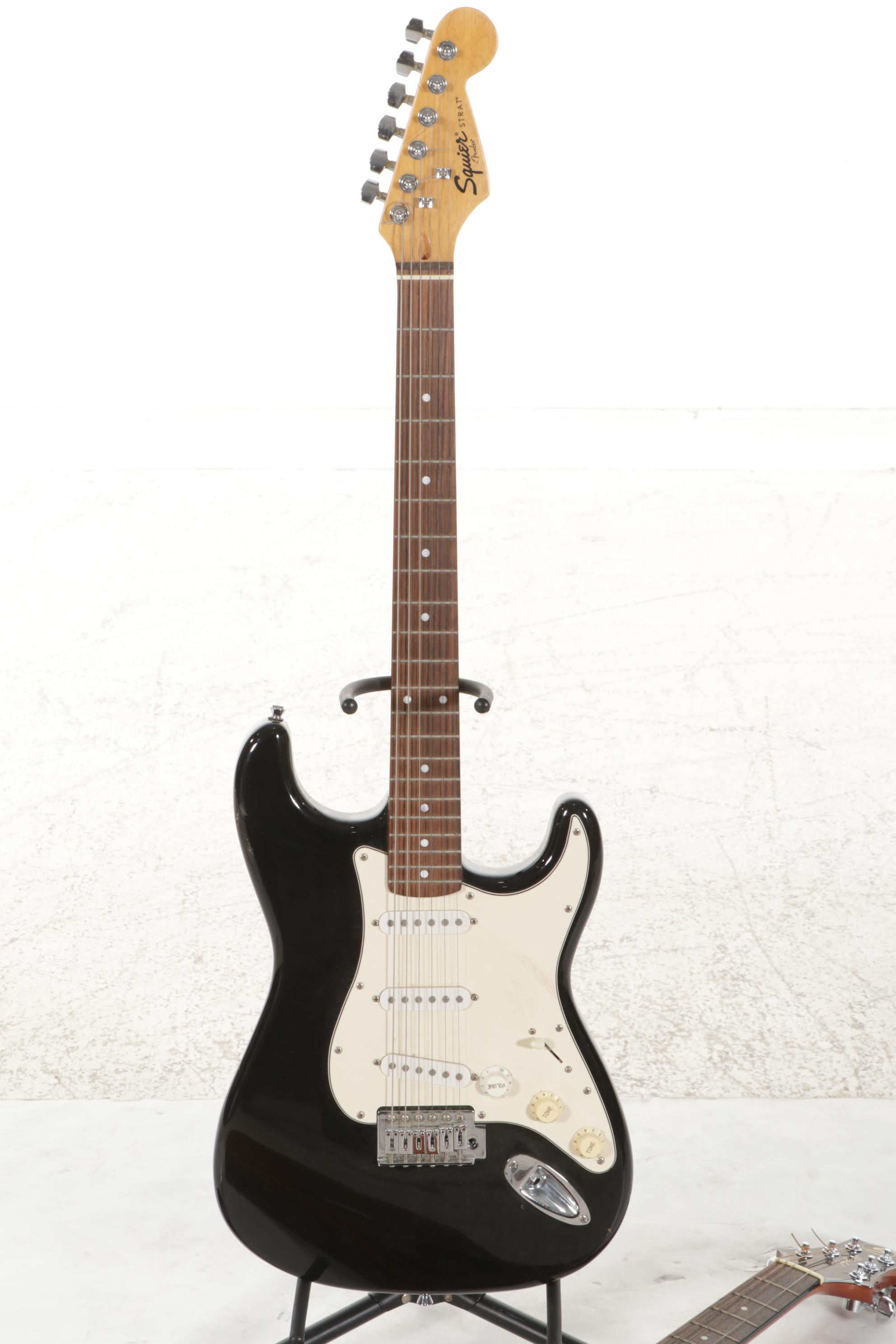 Squier Stratocaster by Fender Electric and Samick Greg Bennett Acoustic Guitars