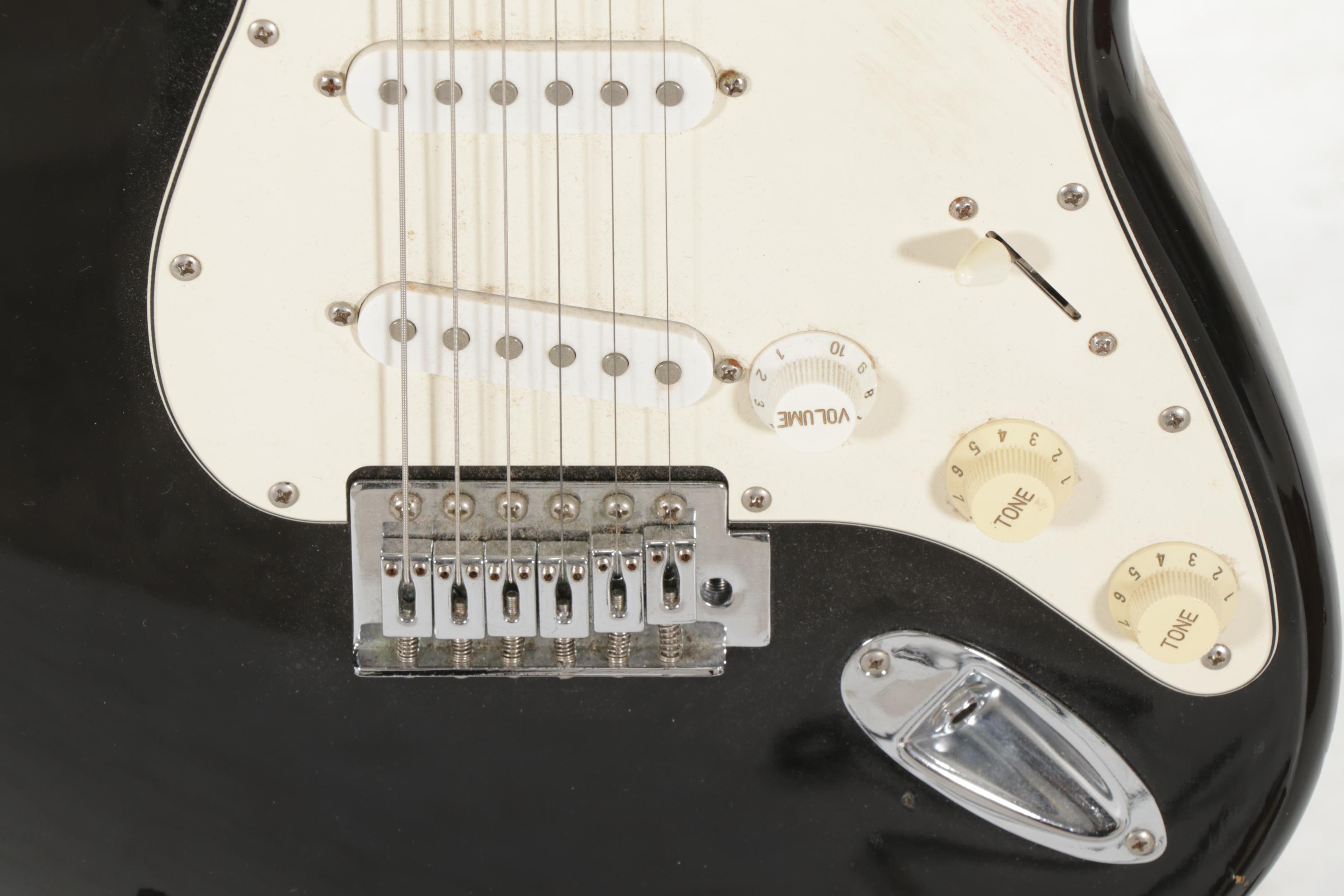 Squier Stratocaster by Fender Electric and Samick Greg Bennett Acoustic Guitars