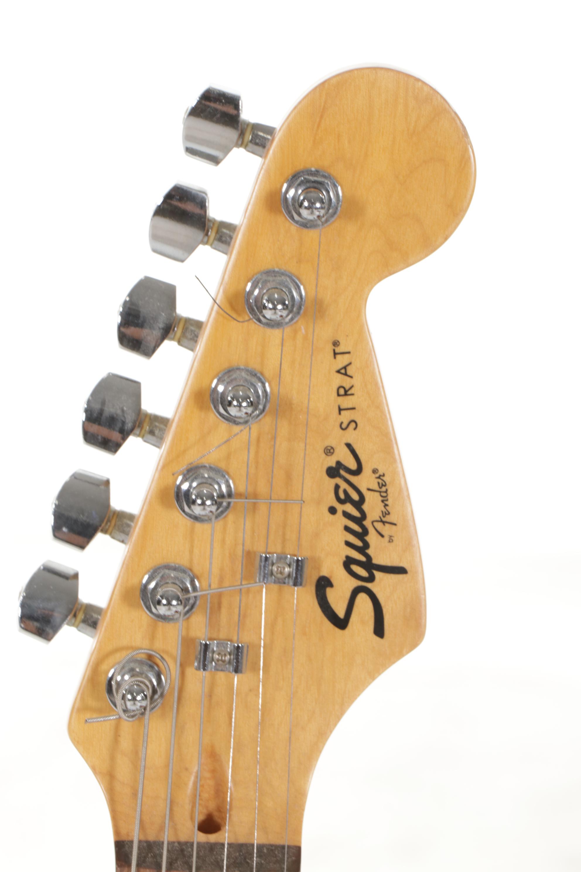 Squier Stratocaster by Fender Electric and Samick Greg Bennett Acoustic Guitars