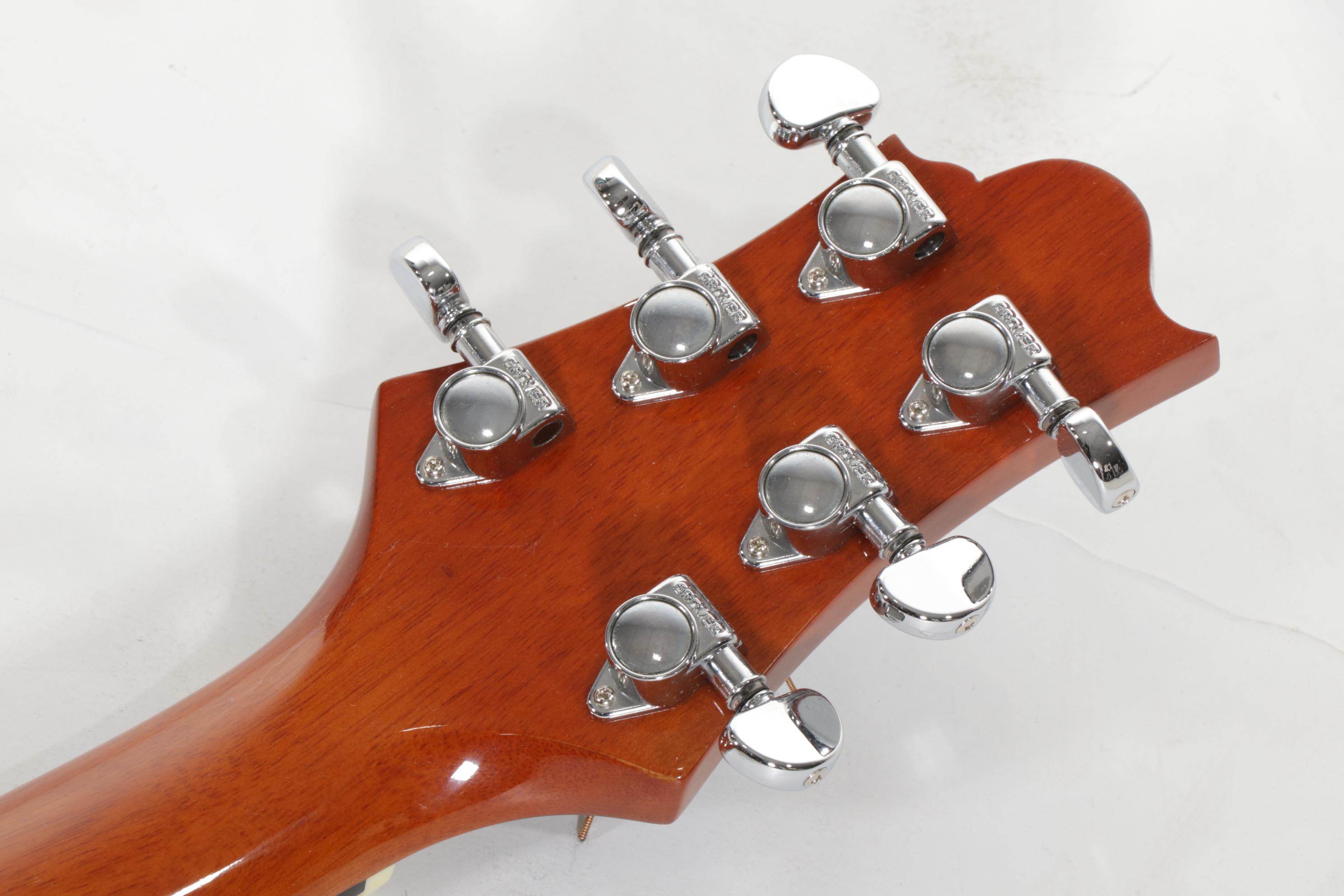 Squier Stratocaster by Fender Electric and Samick Greg Bennett Acoustic Guitars