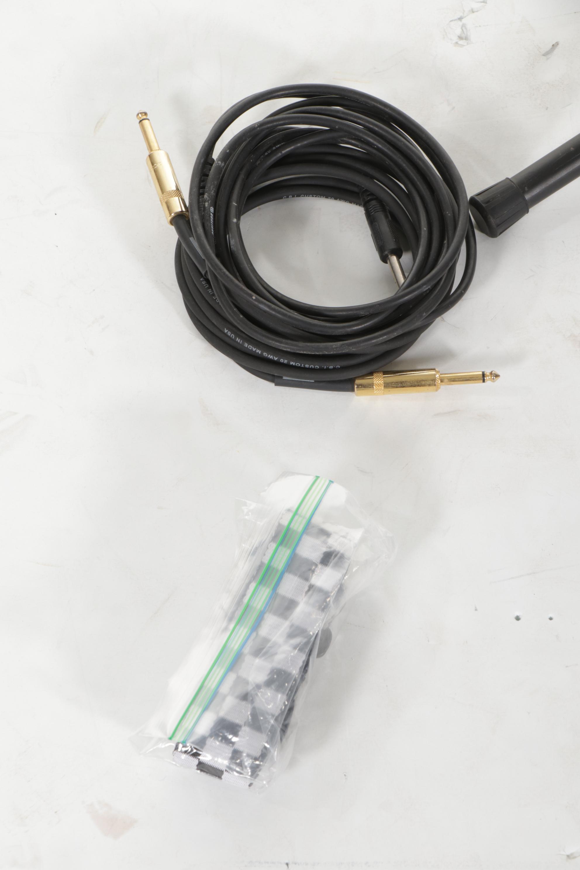 Squier Stratocaster by Fender Electric and Samick Greg Bennett Acoustic Guitars