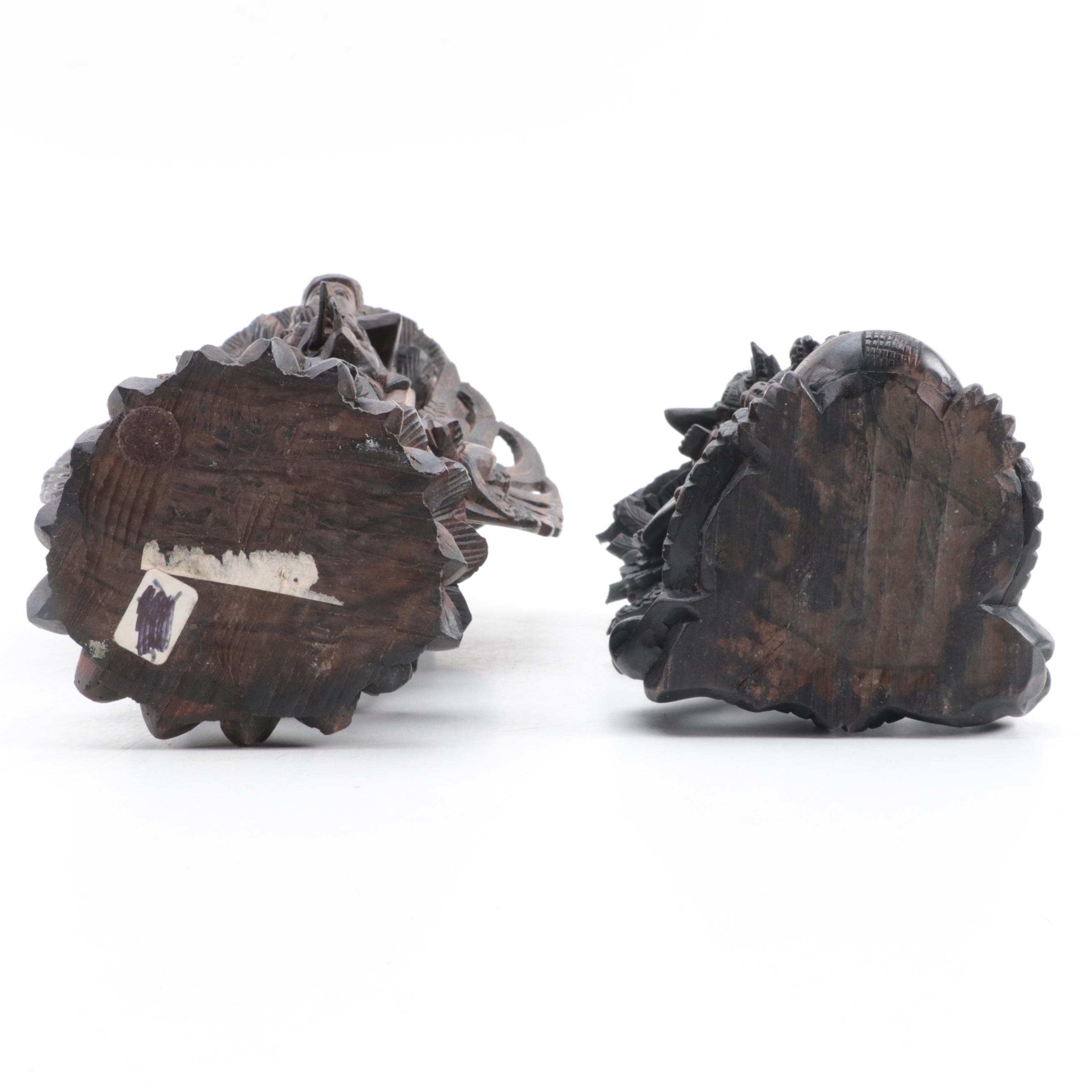 Indonesian Carved Wood Cili Masks and Vishnu Riding Garuda Sculptures