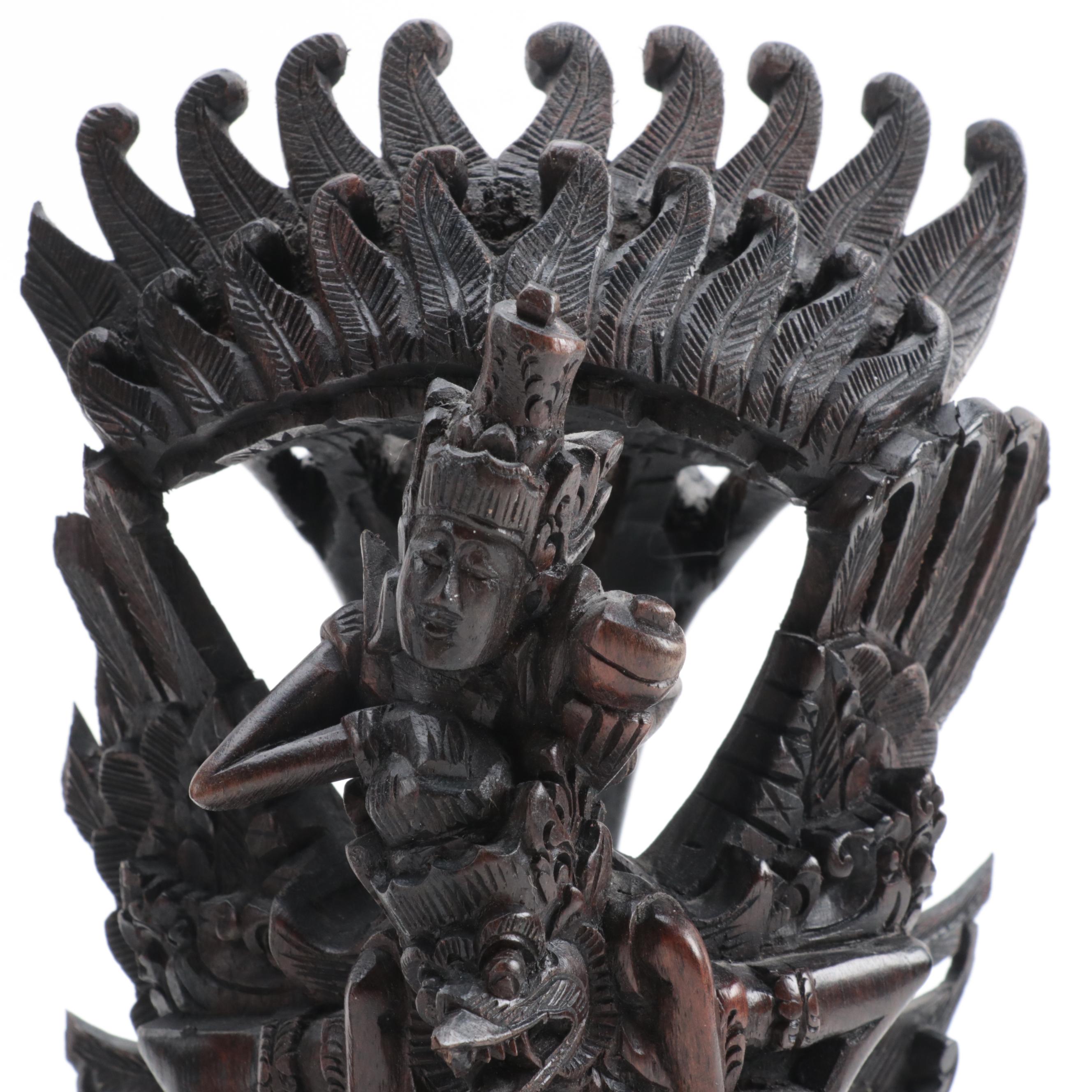 Indonesian Carved Wood Cili Masks and Vishnu Riding Garuda Sculptures