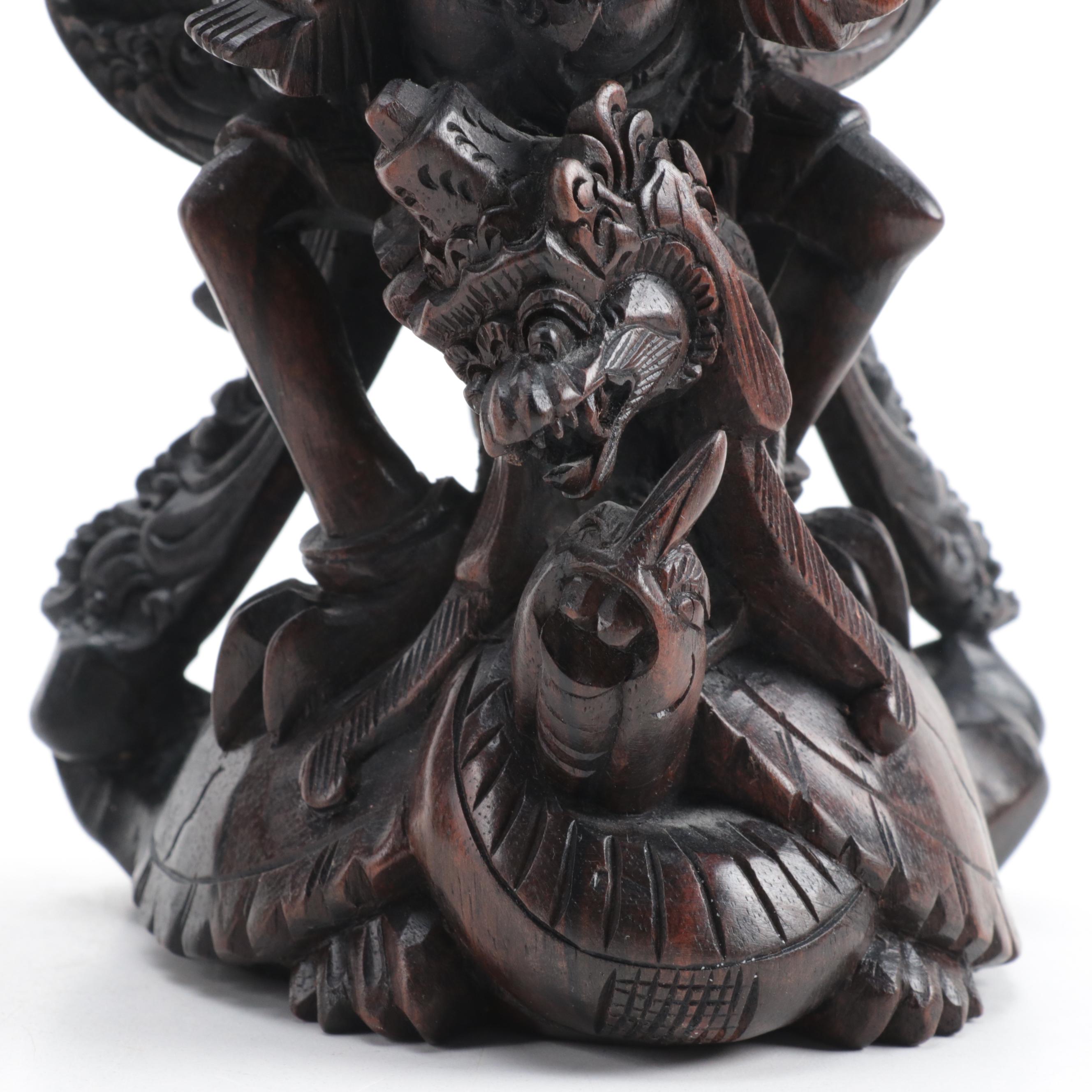 Indonesian Carved Wood Cili Masks and Vishnu Riding Garuda Sculptures