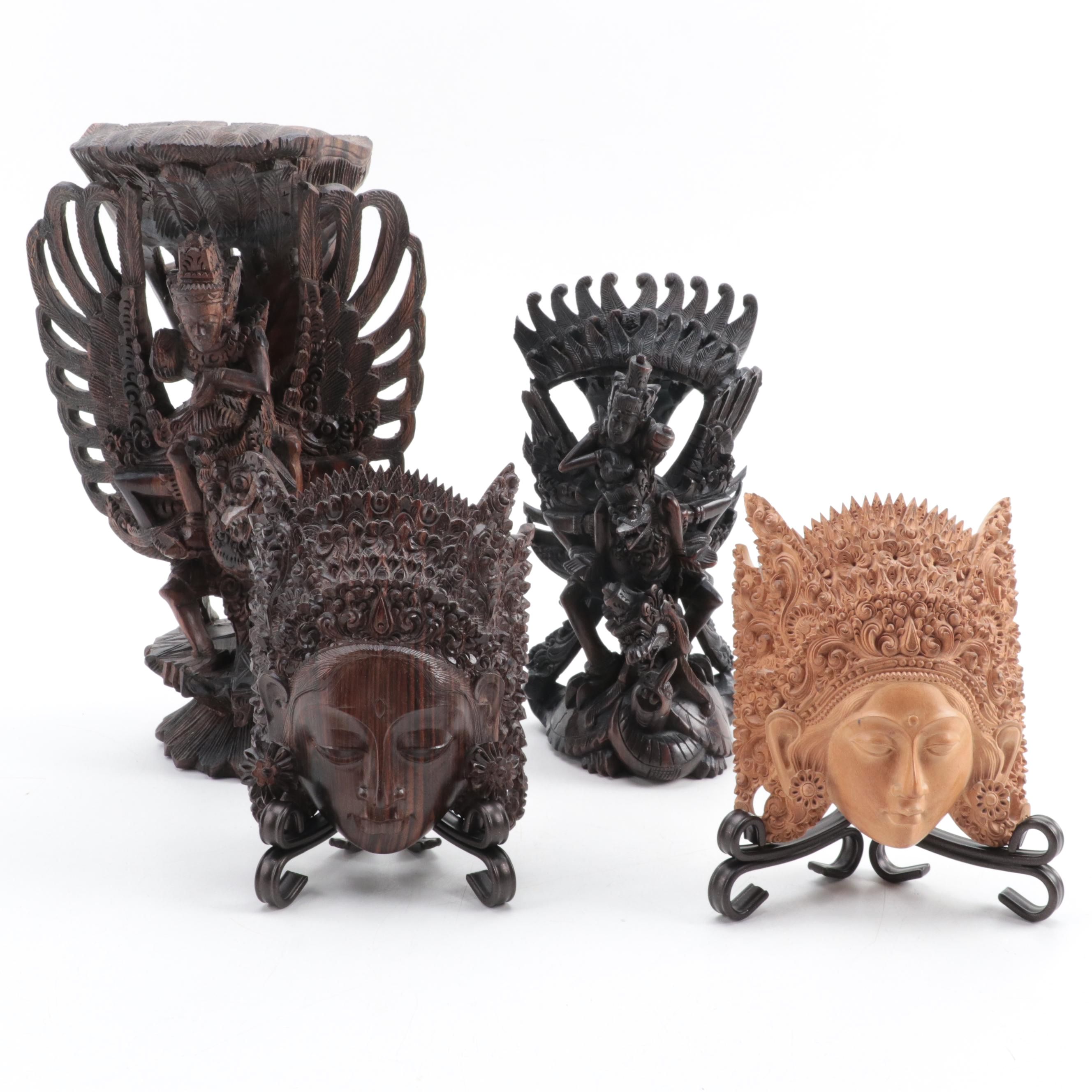 Indonesian Carved Wood Cili Masks and Vishnu Riding Garuda Sculptures