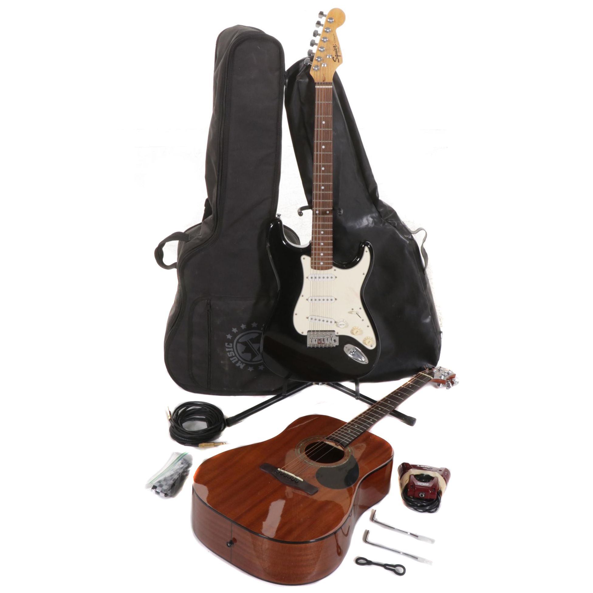 Squier Stratocaster by Fender Electric and Samick Greg Bennett Acoustic Guitars