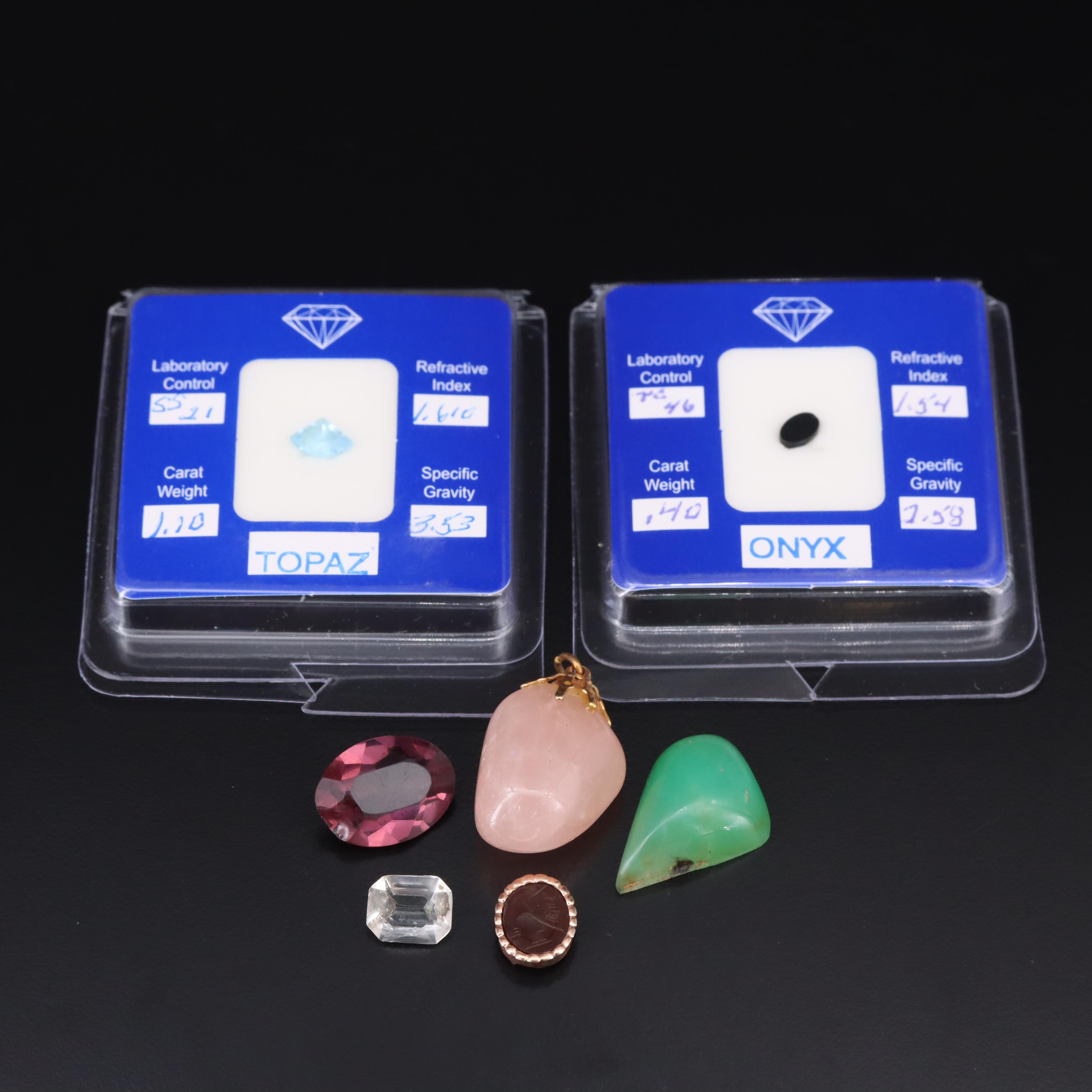 Loose Gemstones Including Rose Quartz and Topaz