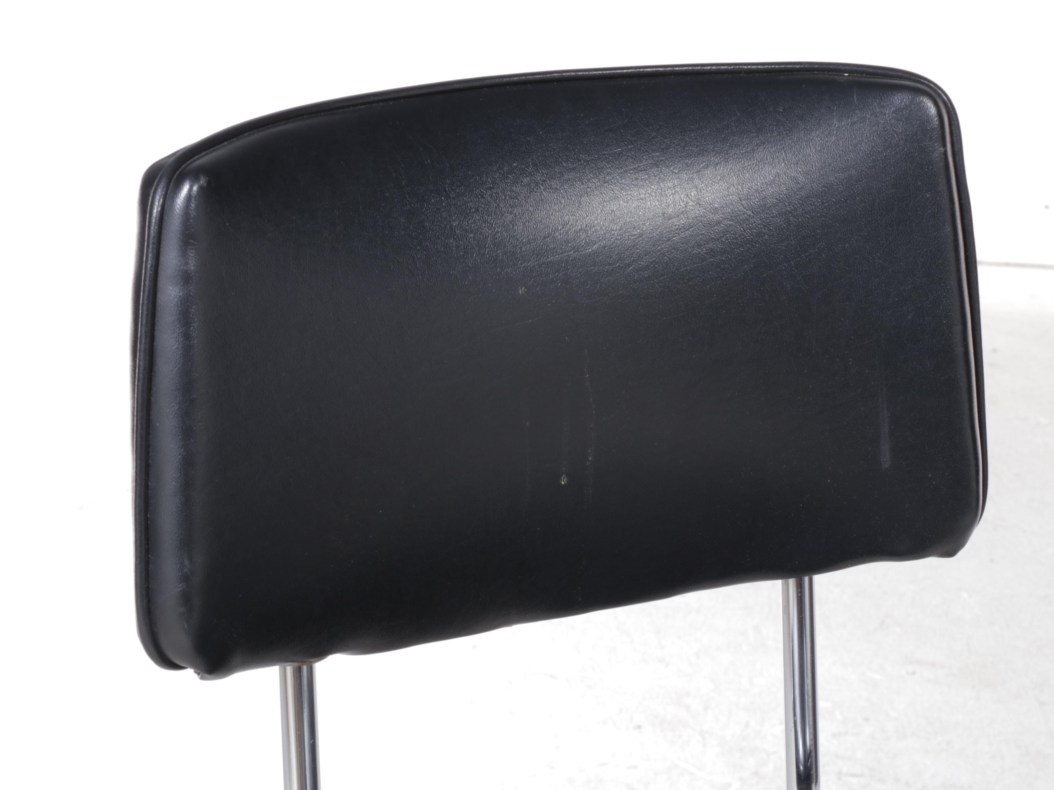 Four Chromcraft Modernist Chromed Steel and Black Vinyl Swivel Bar Stools