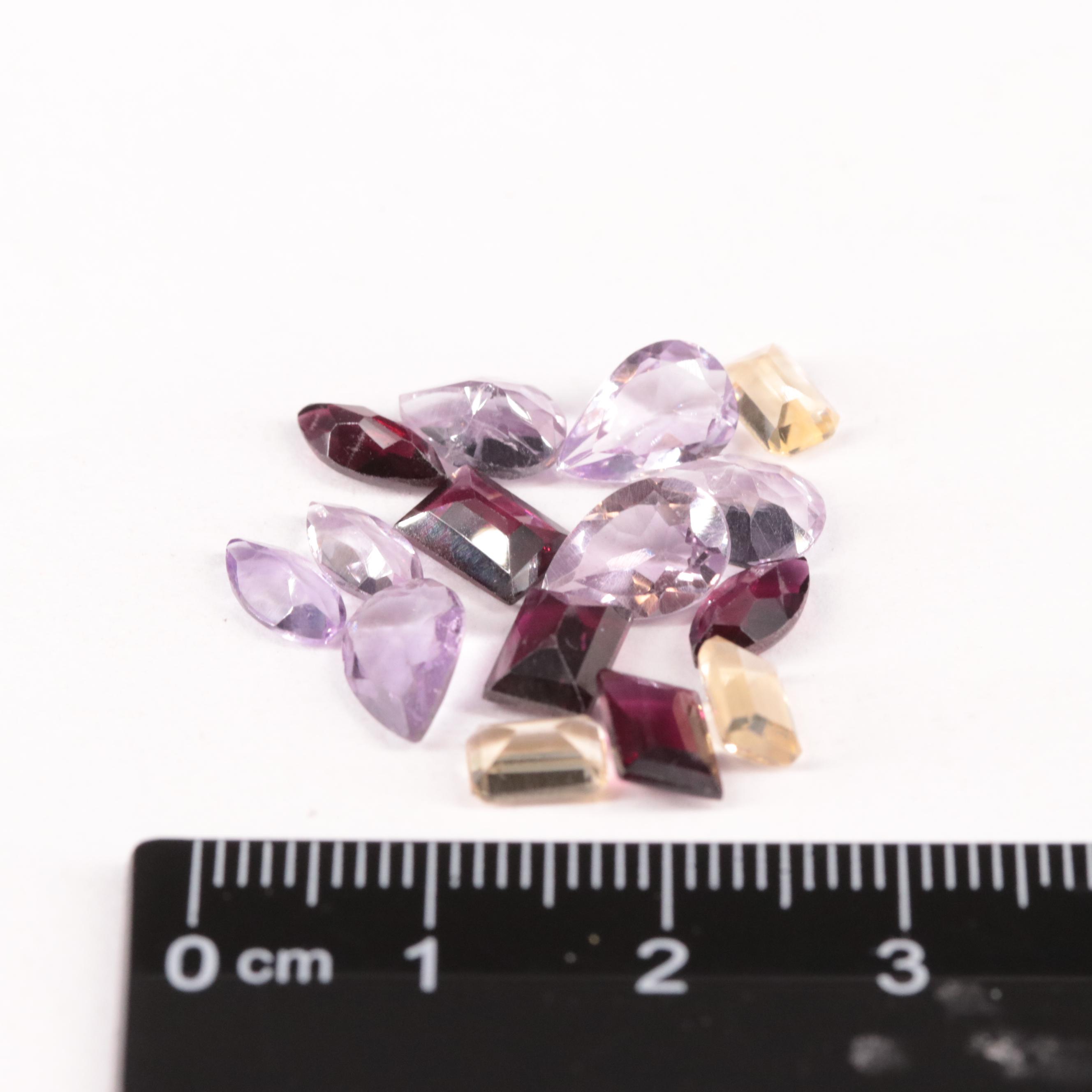 Loose 12.76 CTW Amethyst, Citrine, and Rhodolite Garnet Lot