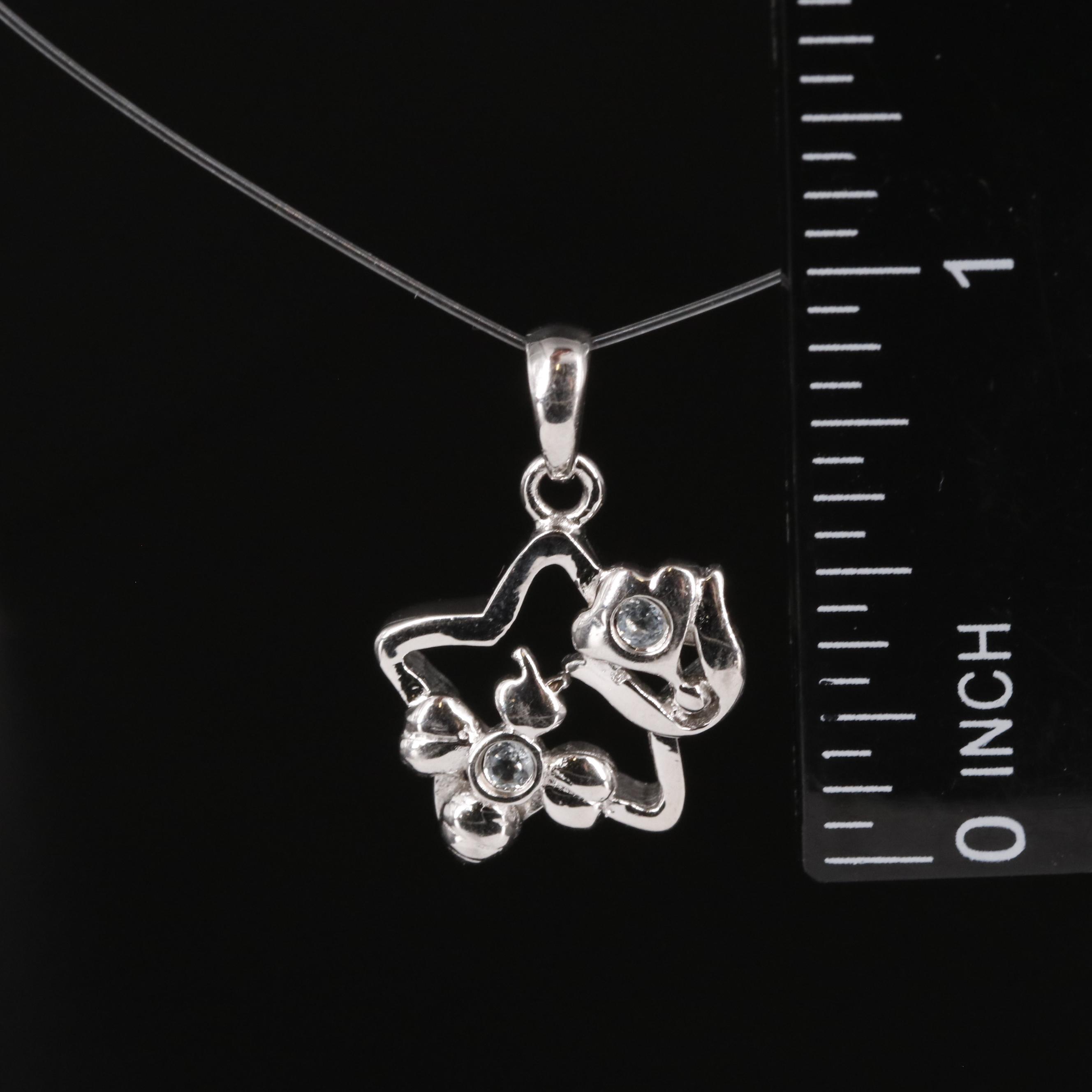 Sterling Aquamarine Star Pendant with Flower Accents