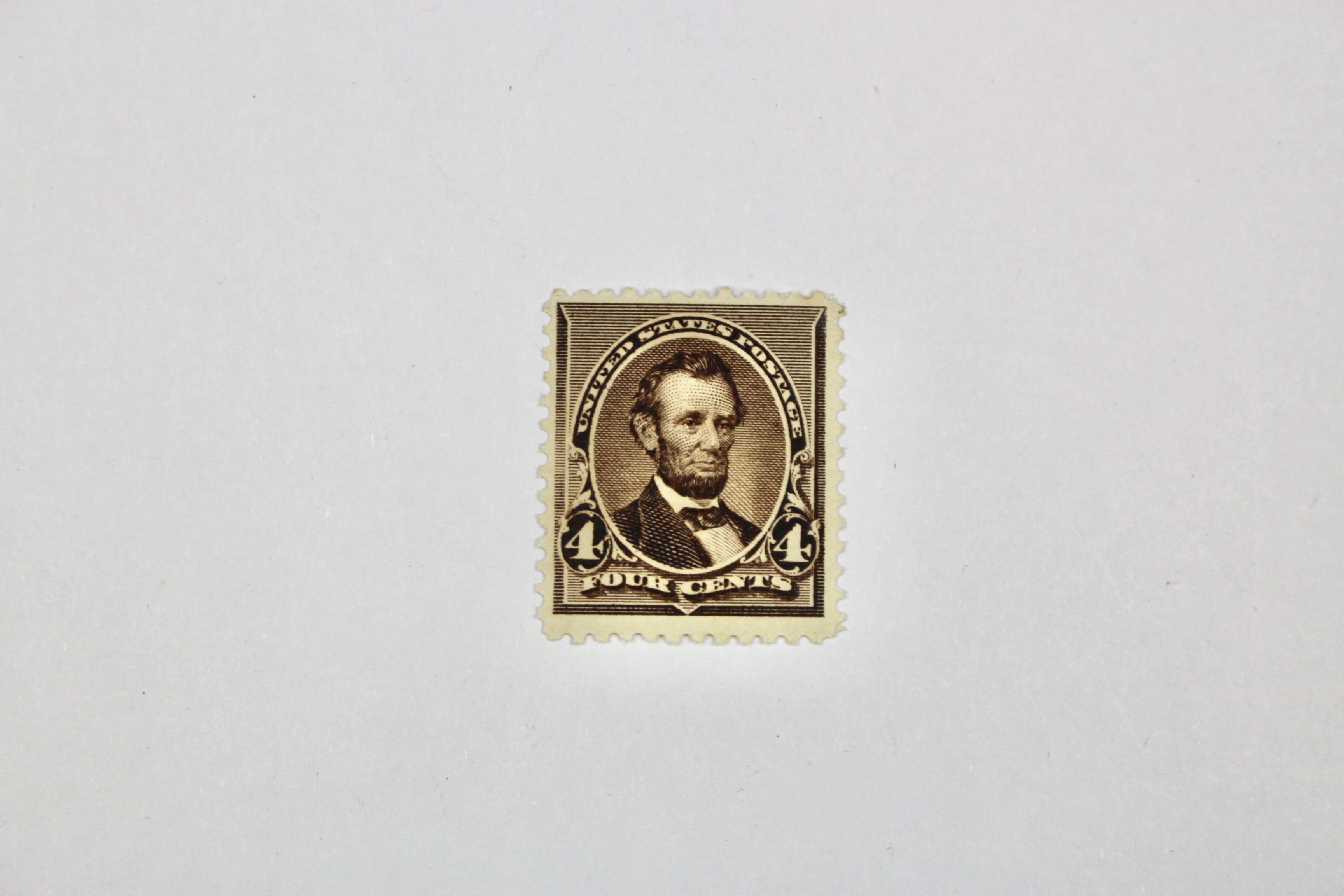 Four Early U.S. Mint Hinged Postage Stamps