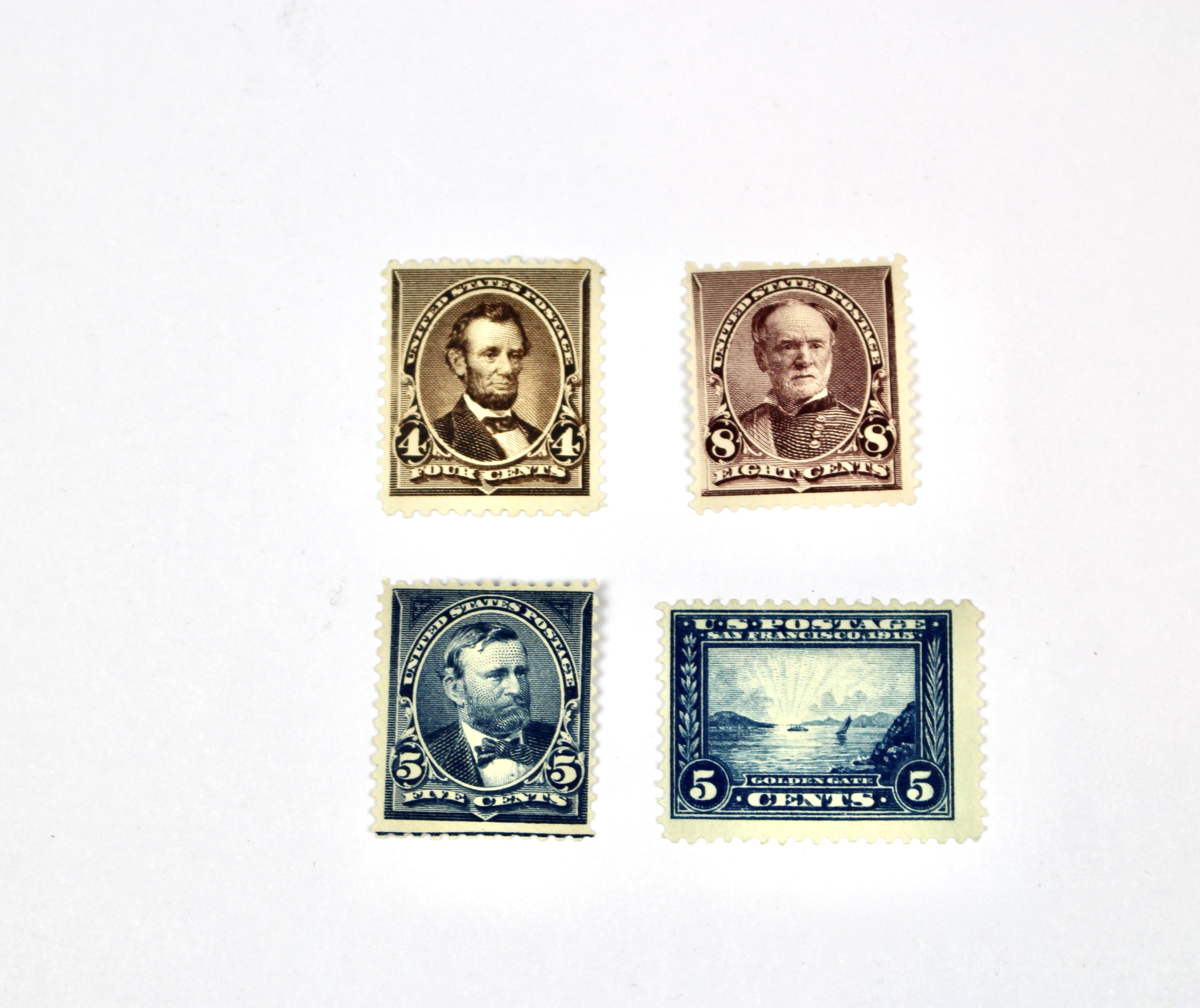 Four Early U.S. Mint Hinged Postage Stamps