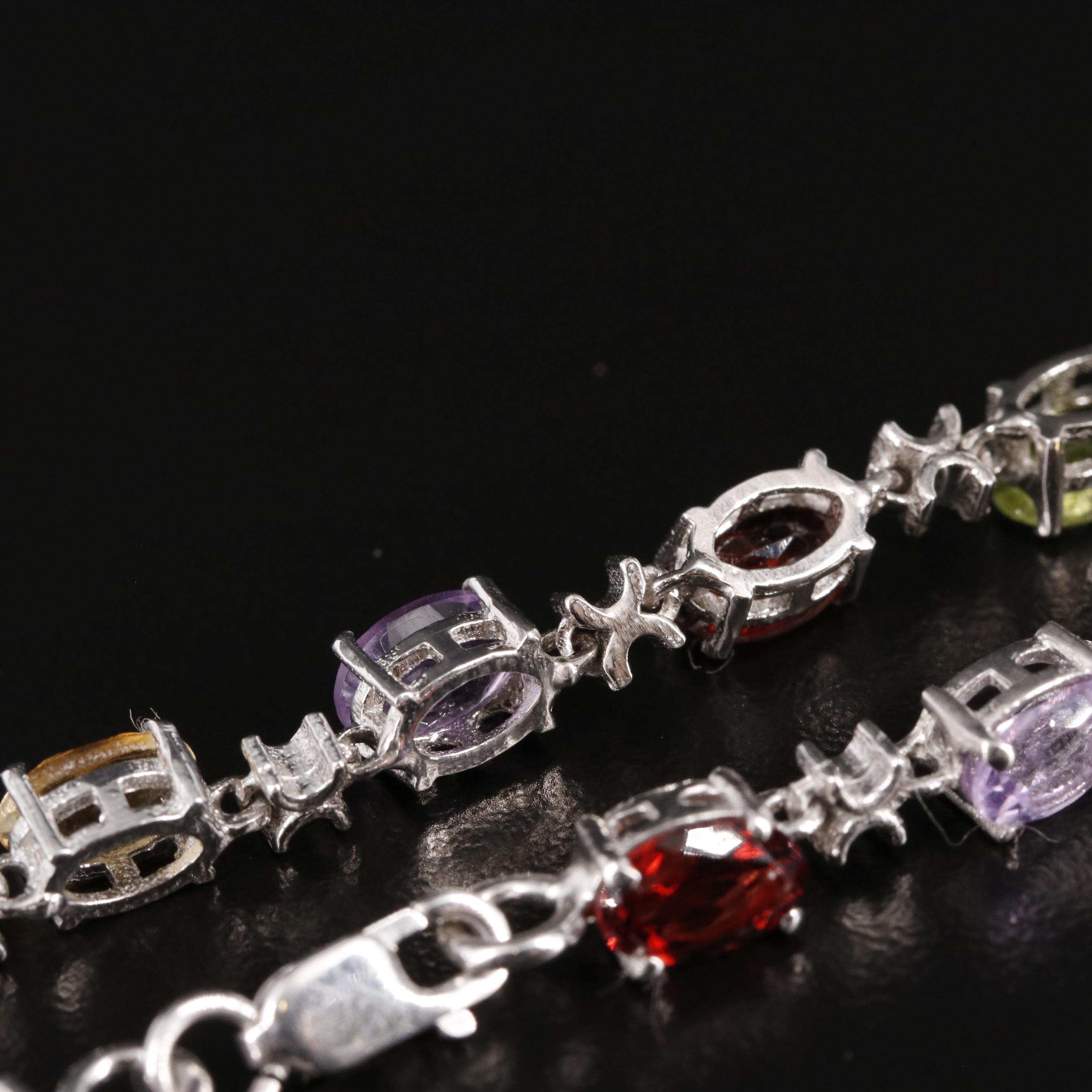 Sterling Amethyst, Blue Topaz, and Rhodelite Garnet Tennis Bracelet