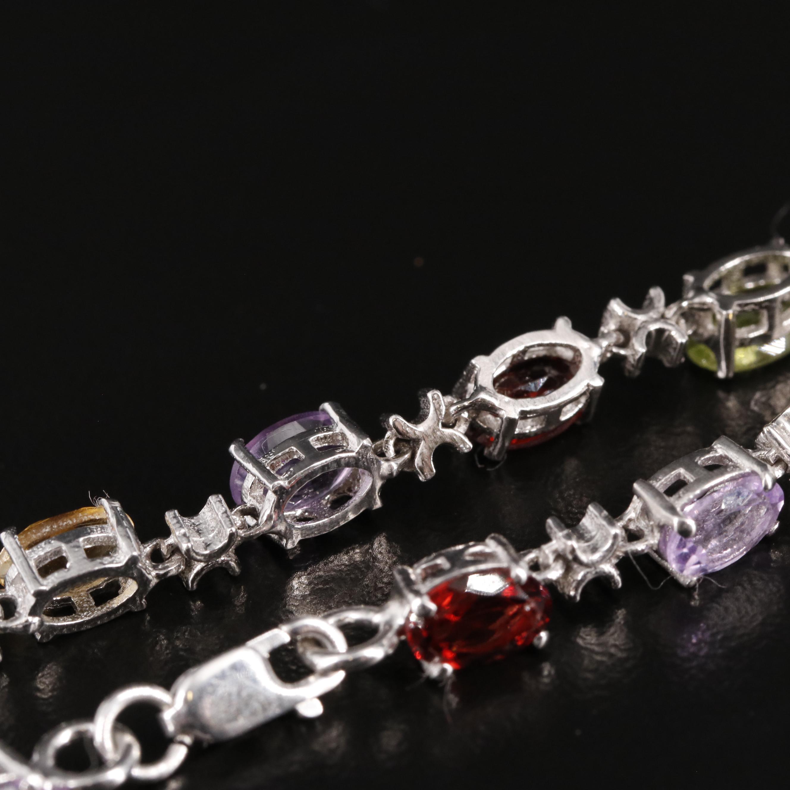 Sterling Amethyst, Blue Topaz, and Rhodelite Garnet Tennis Bracelet