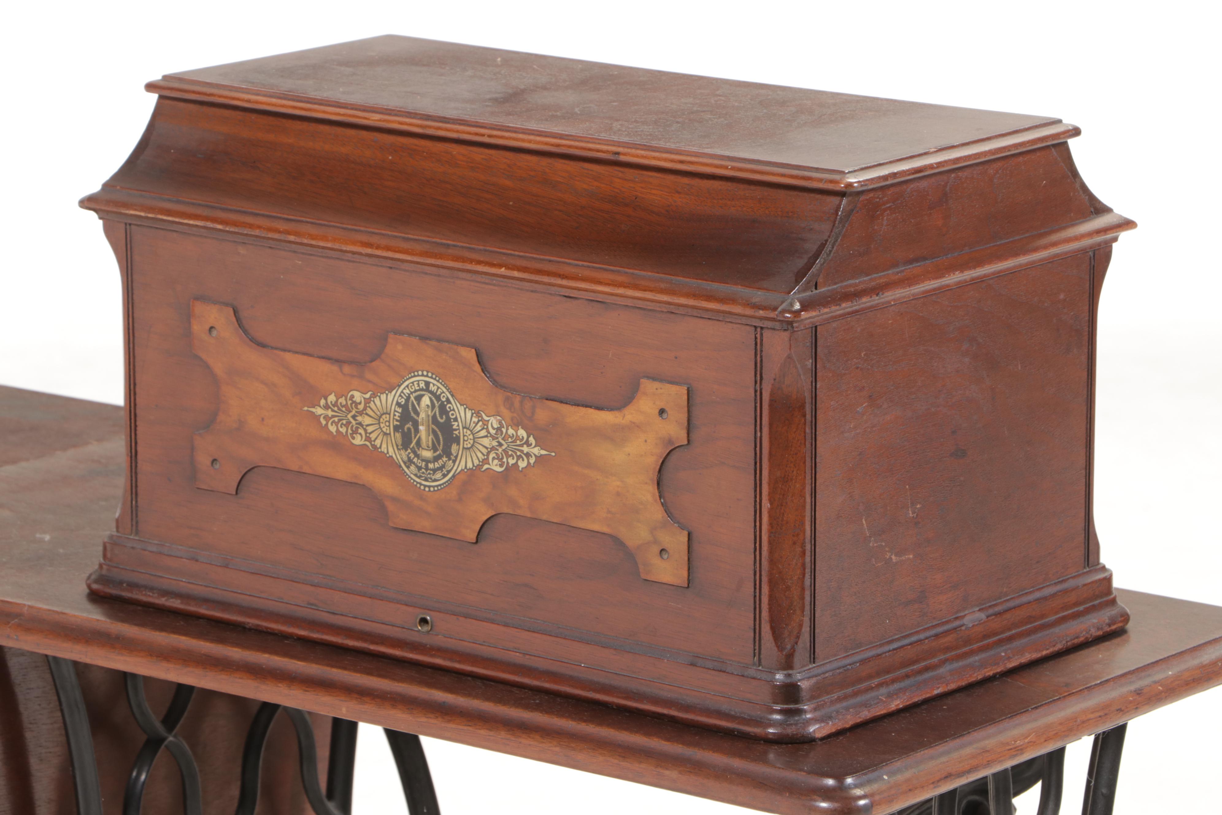 The Singer Mfg. Co. Walnut and Cast Iron Treadle-Base Sewing Machine