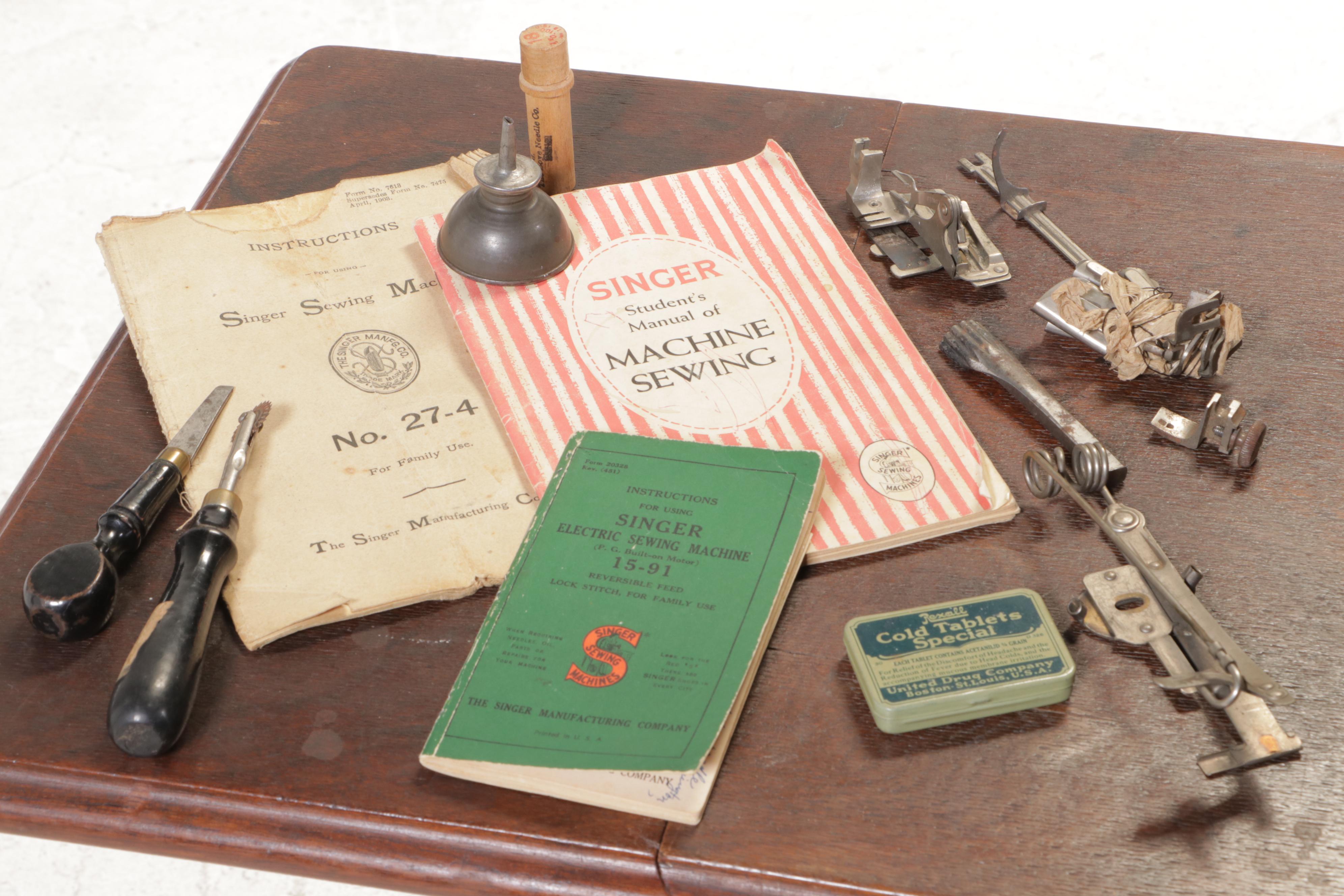 The Singer Mfg. Co. Walnut and Cast Iron Treadle-Base Sewing Machine