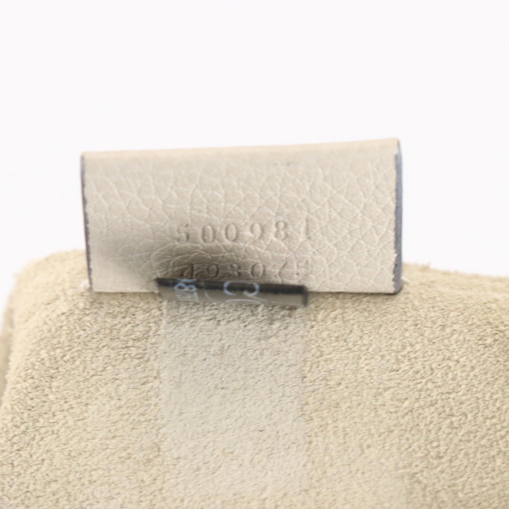 Gucci Zip Clutch in Logo Print Grain Leather