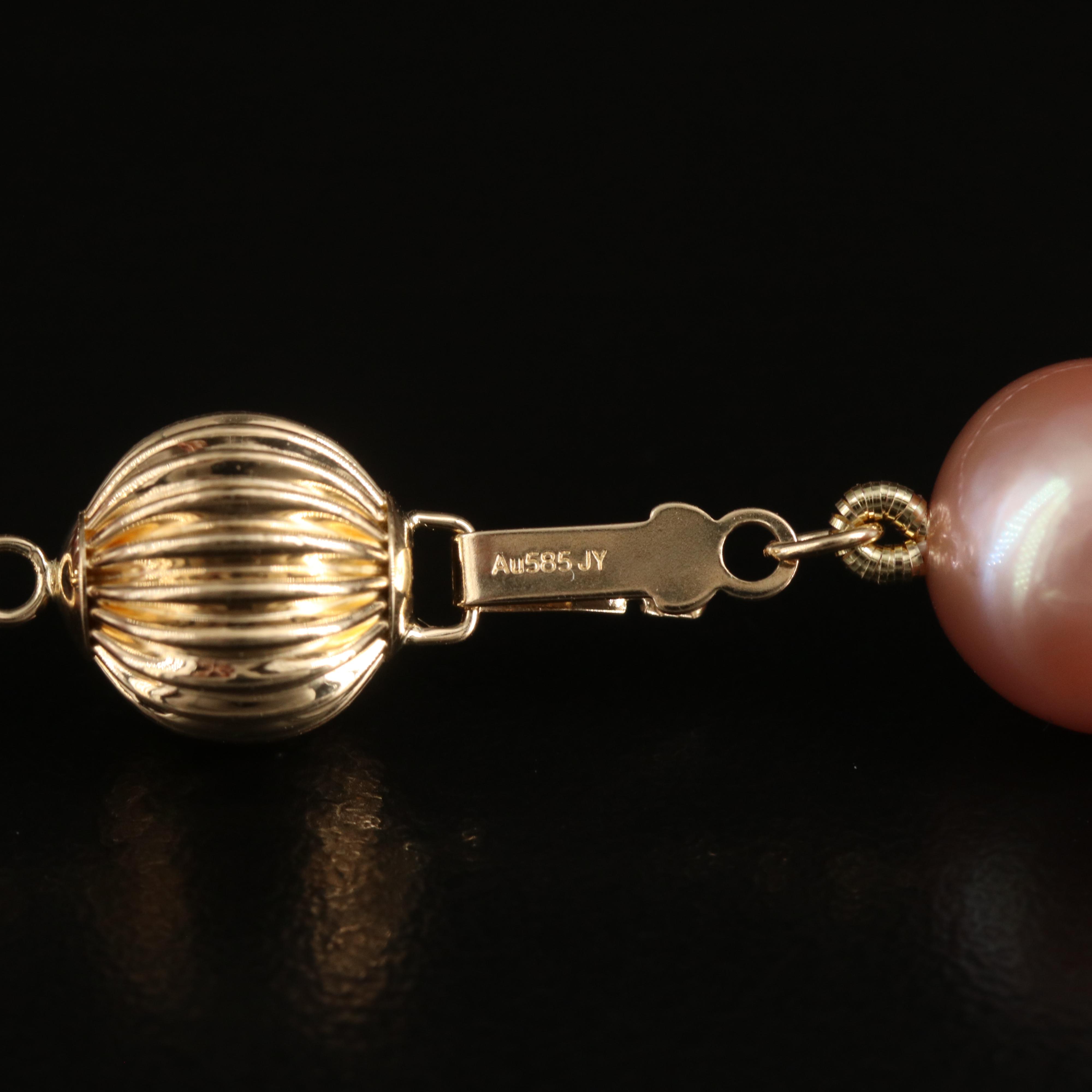 Graduated 10.00 - 13.00 mm Pearl Necklace with 14K Clasp