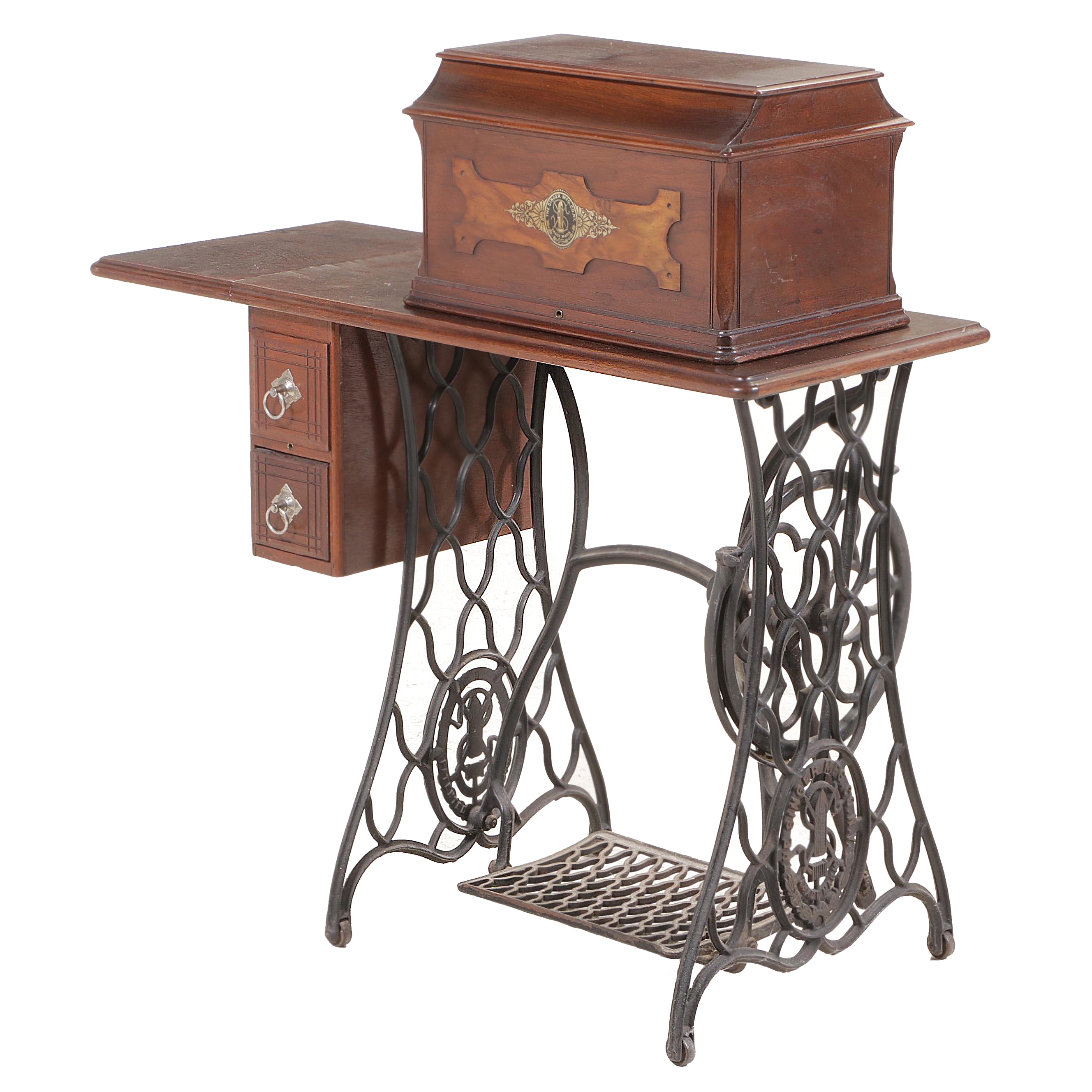 The Singer Mfg. Co. Walnut and Cast Iron Treadle-Base Sewing Machine