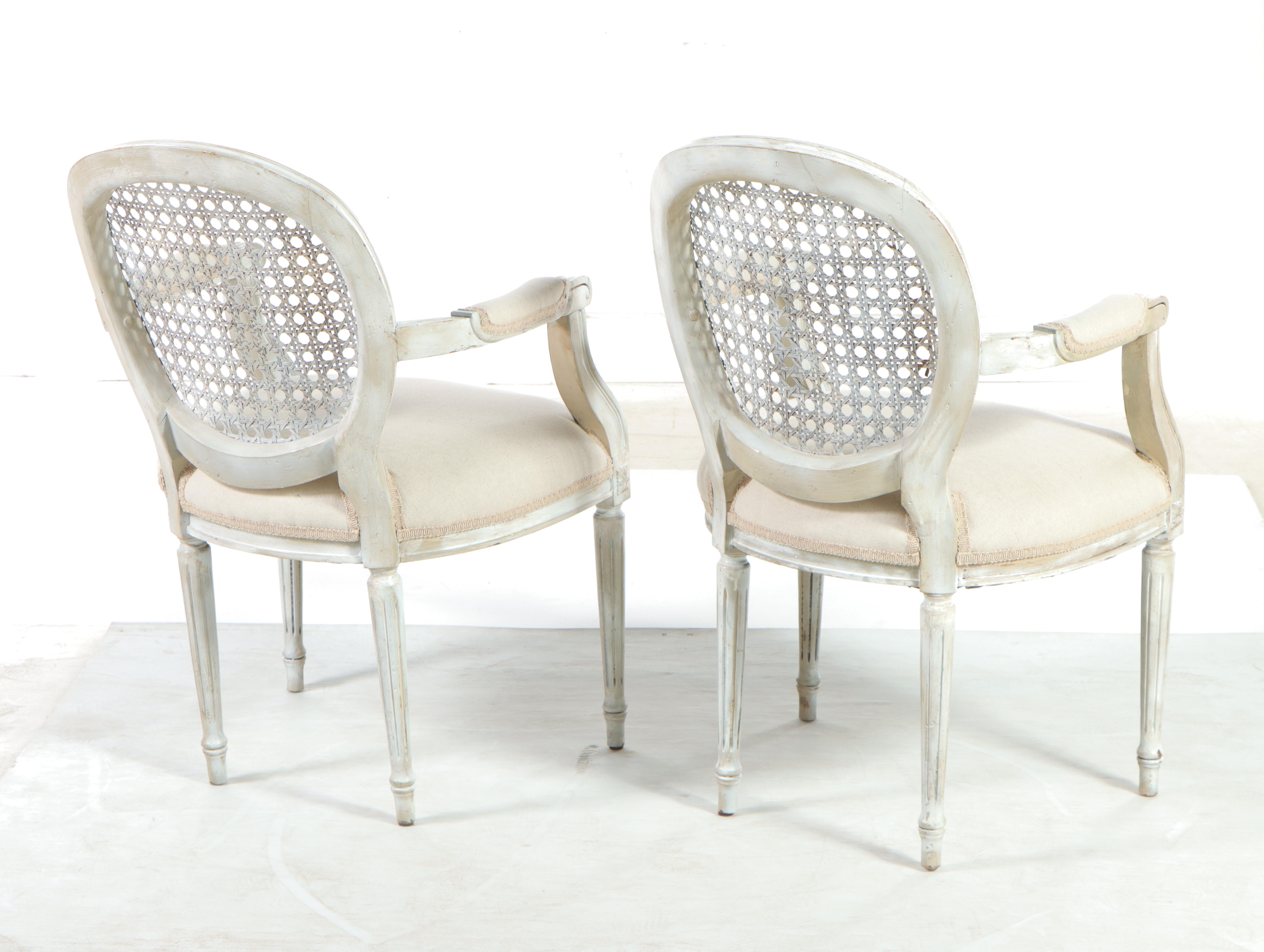 Pair of Gustavian Style White-Painted Wood and Caned Back Armchairs