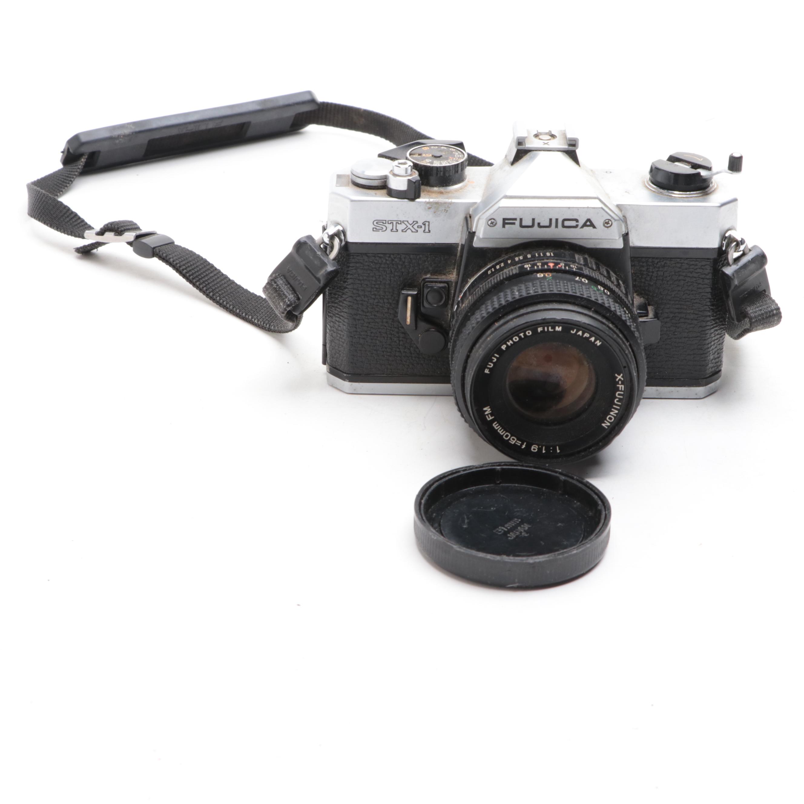 Fujica STX-1 SLR Camera with Case, Flashes, Lens and More Accessories