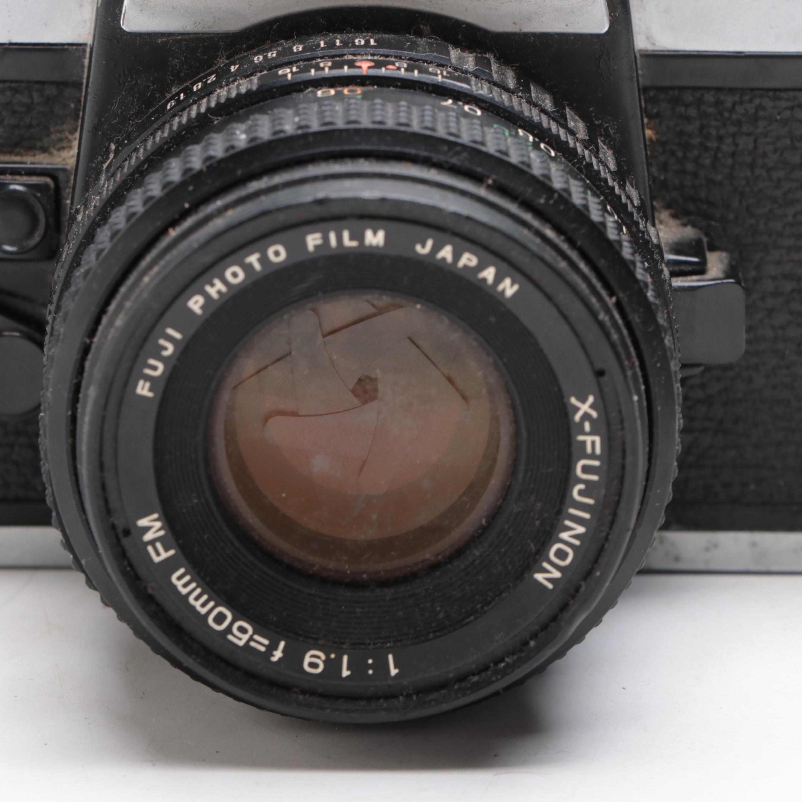 Fujica STX-1 SLR Camera with Case, Flashes, Lens and More Accessories