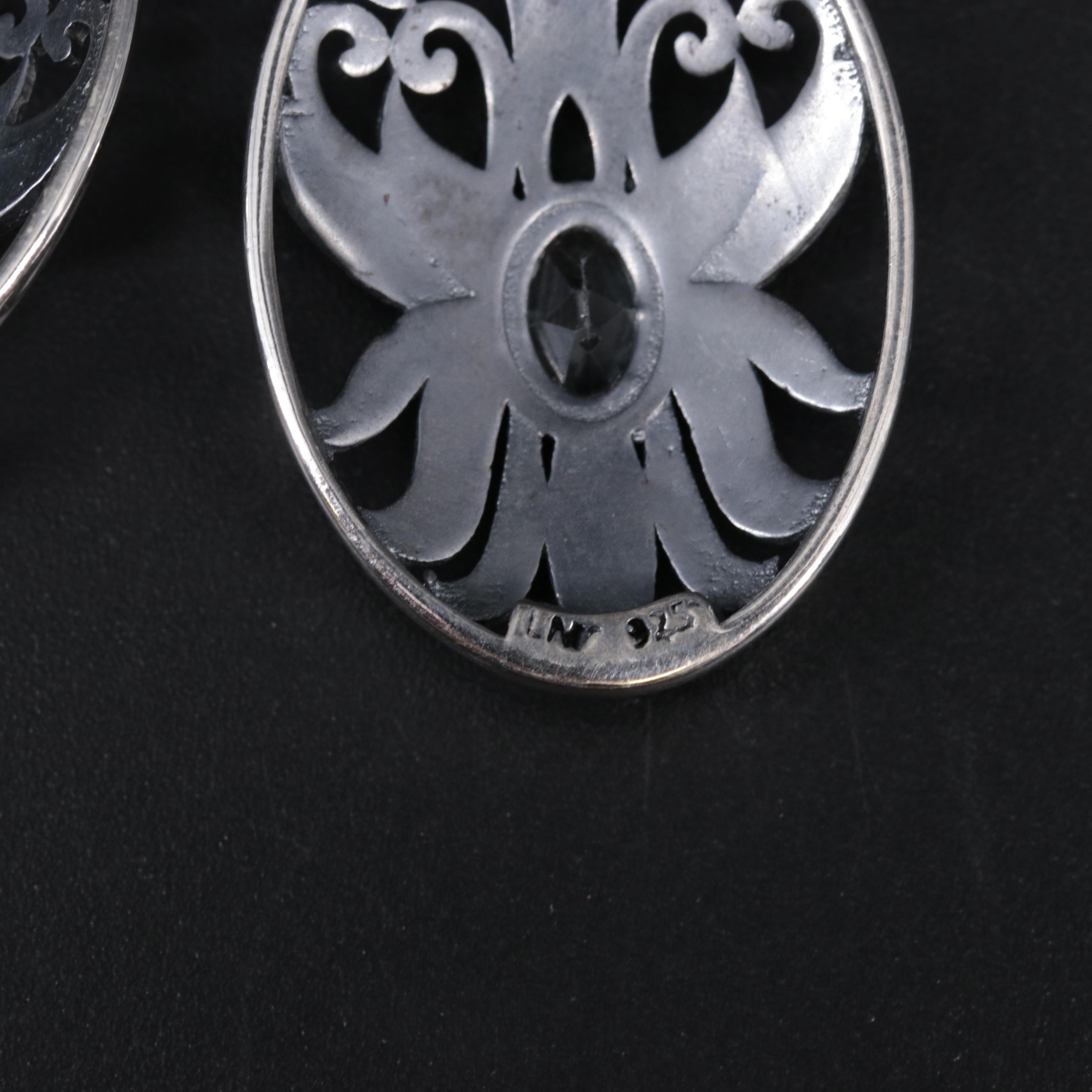 Sterling Silver Earrings Including Blue Topaz