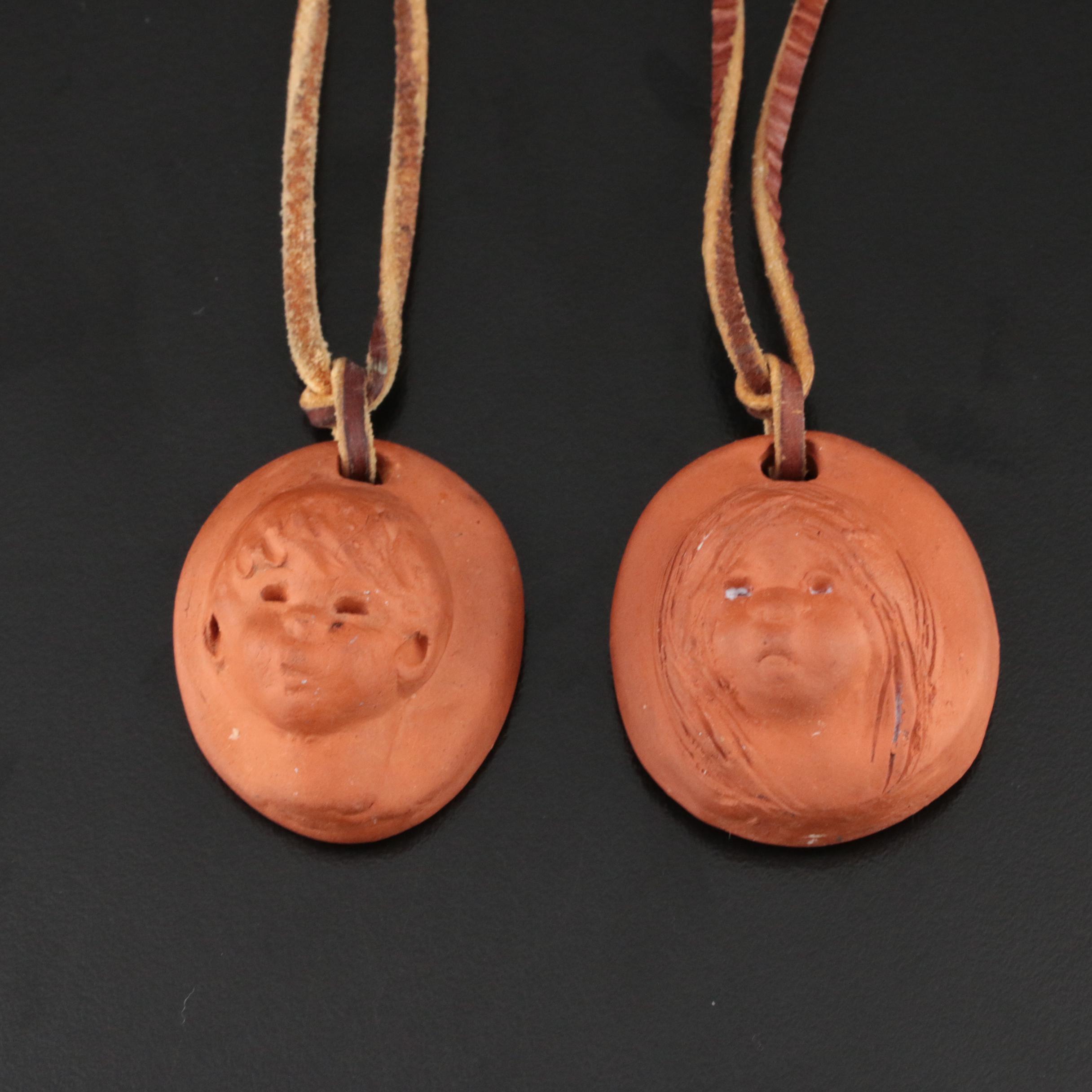 Ann Entis Sculpted Terracotta Boy and Girl Pendant Necklaces