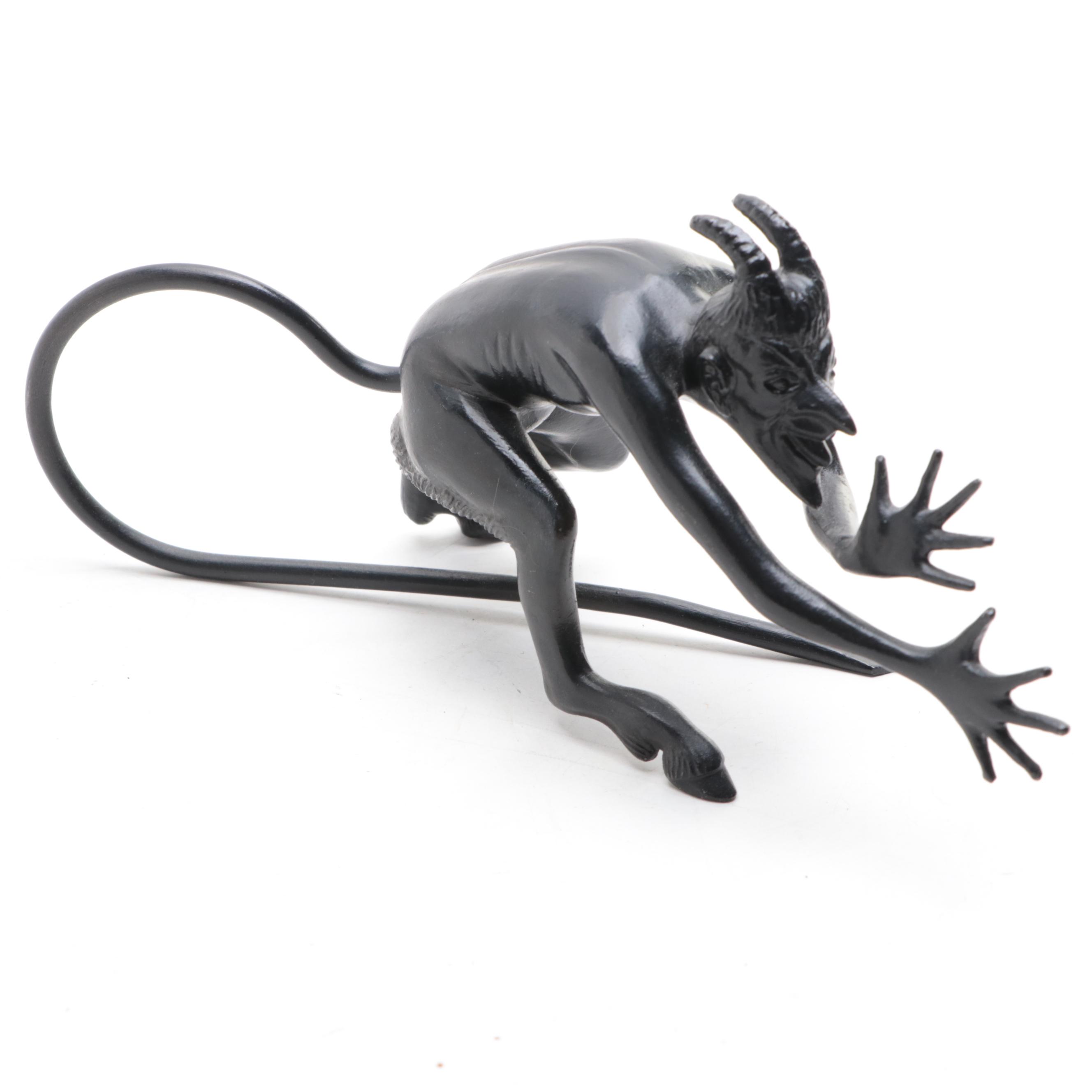 Patinated Cast Metal Devil Sculpture with Stained Glass and Wire Dragonfly