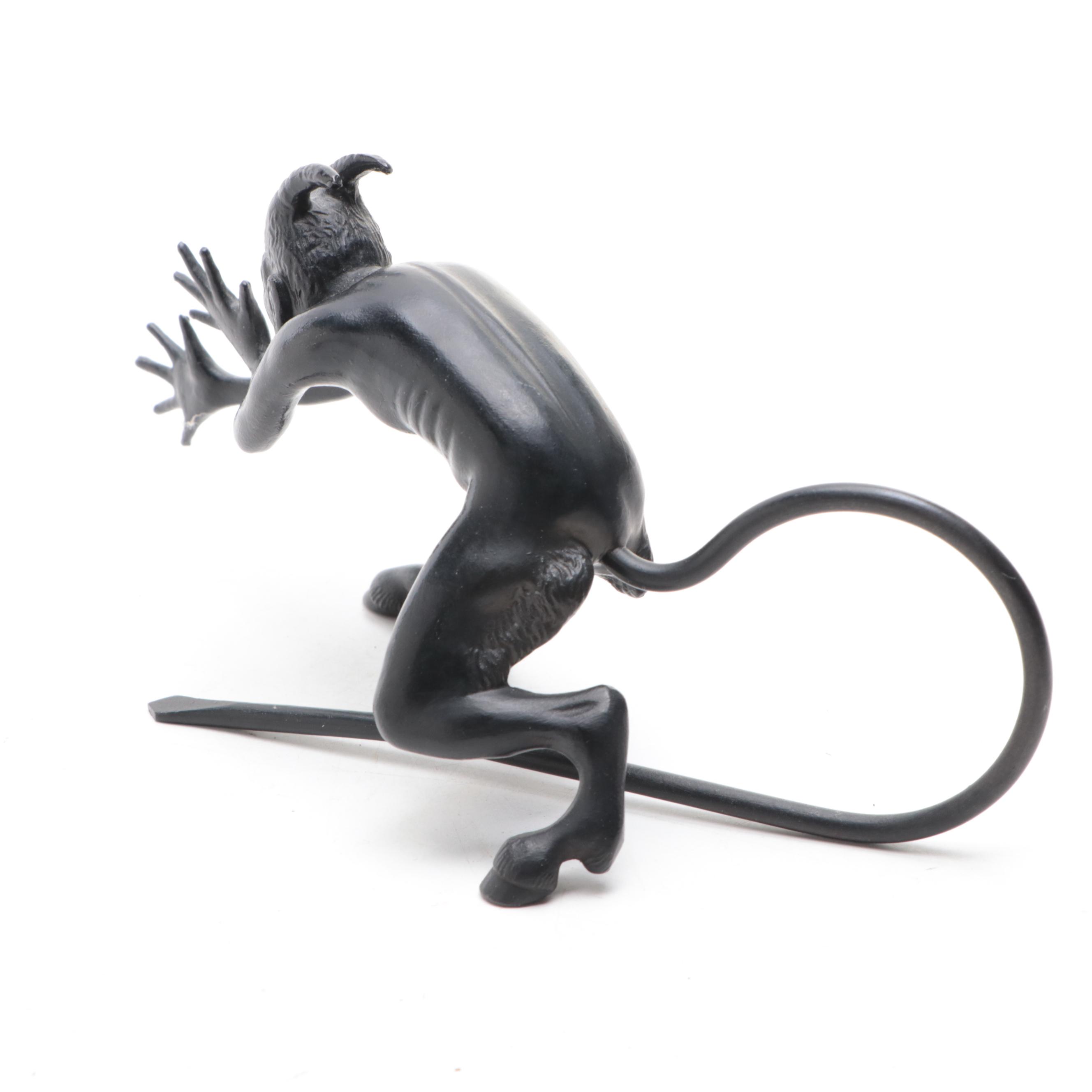 Patinated Cast Metal Devil Sculpture with Stained Glass and Wire Dragonfly