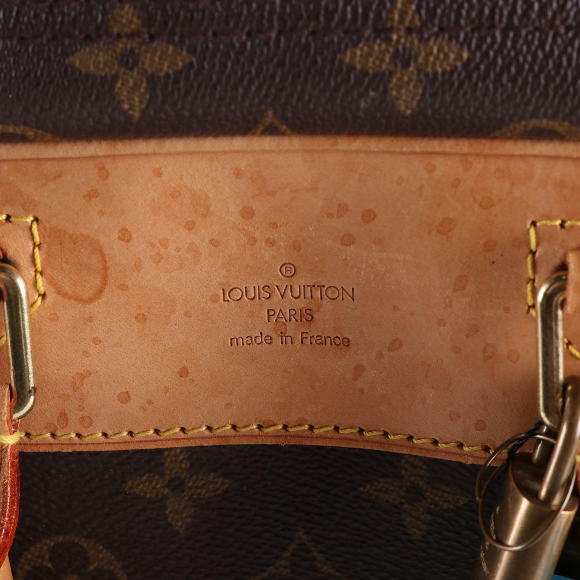 Louis Vuitton Evasion MM Travel Bag in Monogram Canvas and Vachetta Leather