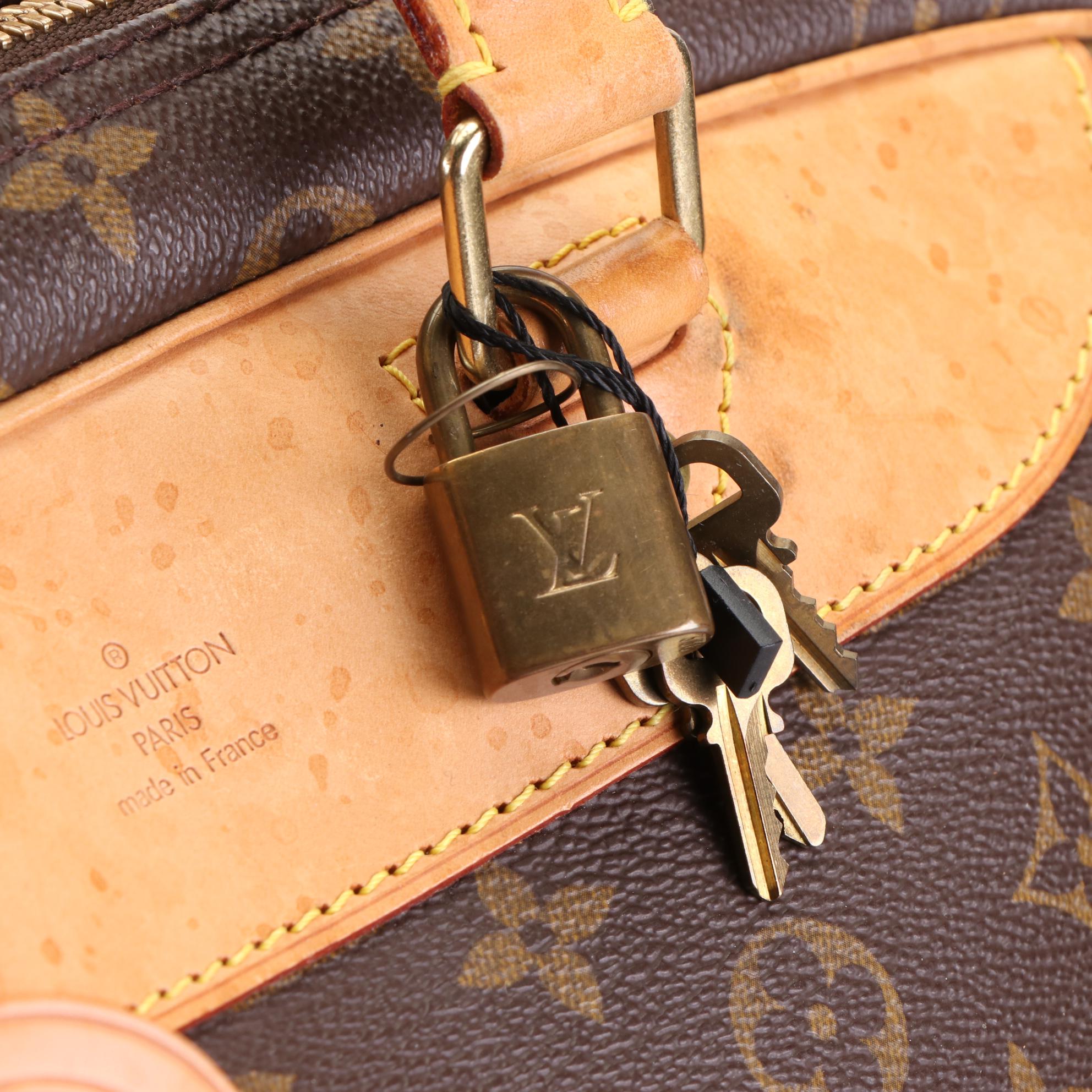 Louis Vuitton Evasion MM Travel Bag in Monogram Canvas and Vachetta Leather