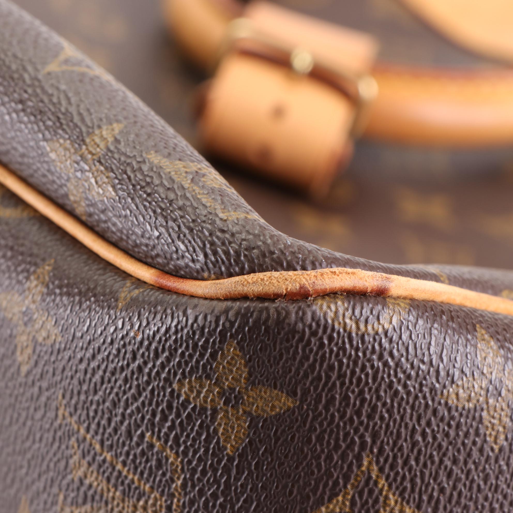 Louis Vuitton Evasion MM Travel Bag in Monogram Canvas and Vachetta Leather