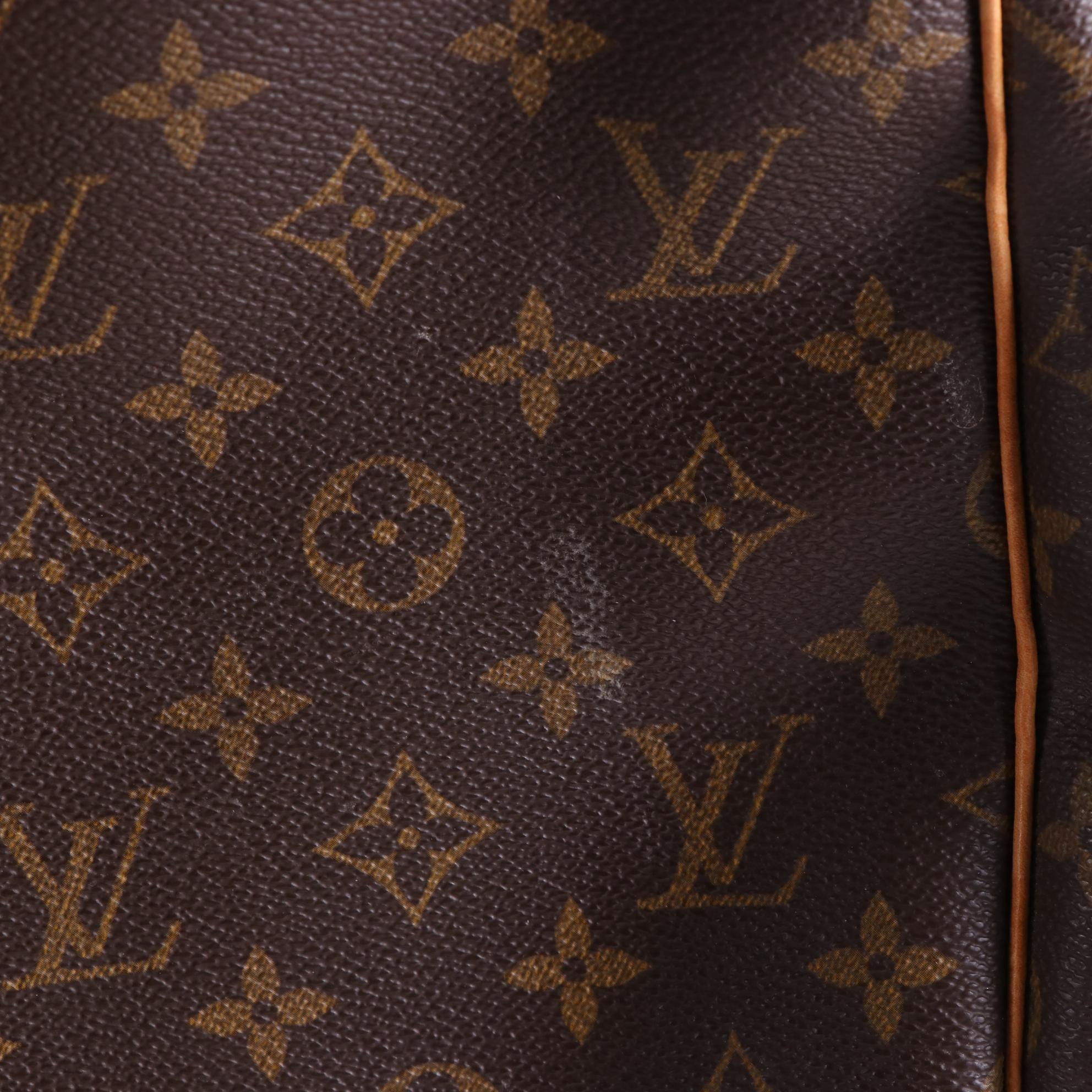Louis Vuitton Evasion MM Travel Bag in Monogram Canvas and Vachetta Leather