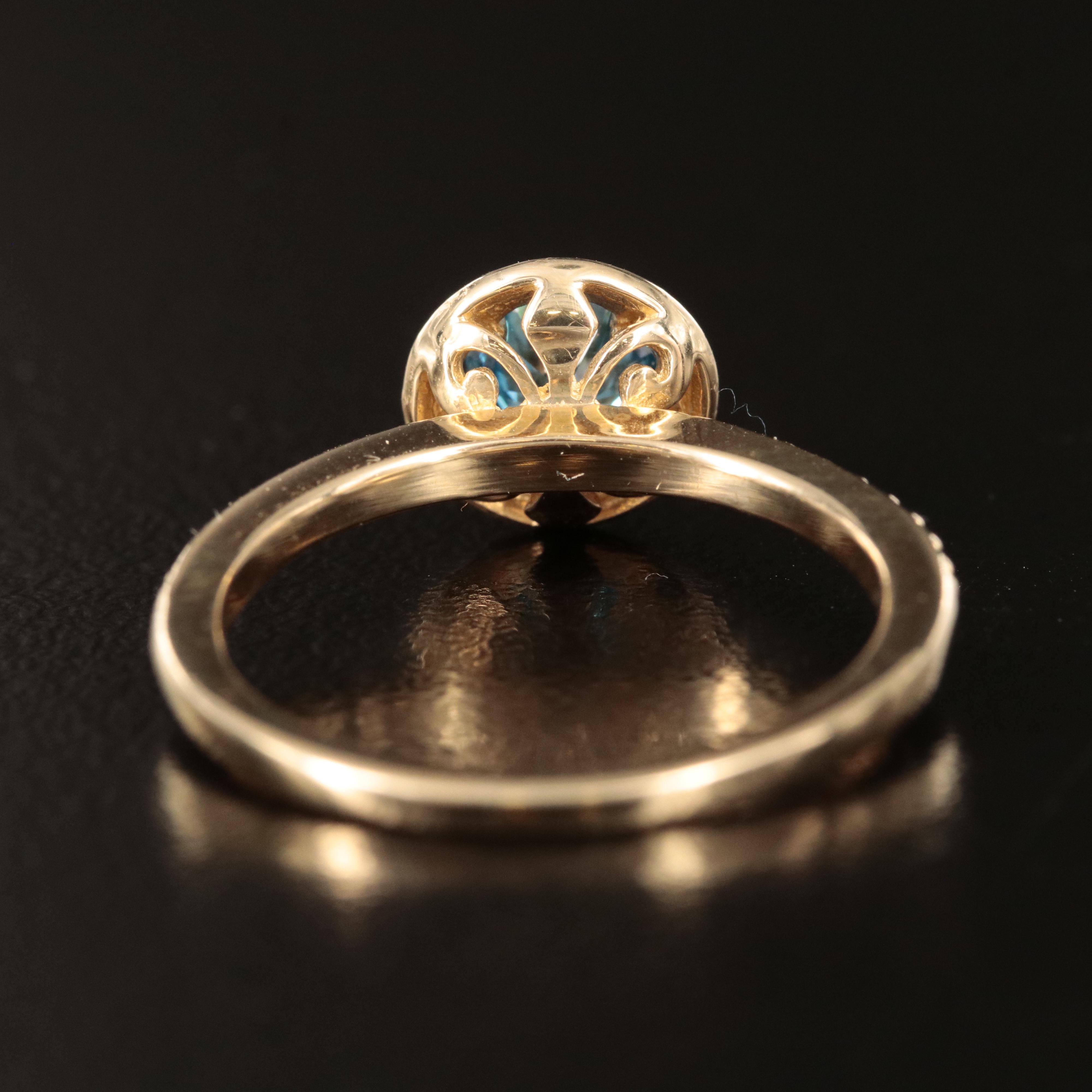 14K 1.01 CTW Diamond Halo Ring with Fancy Intense Blue Center