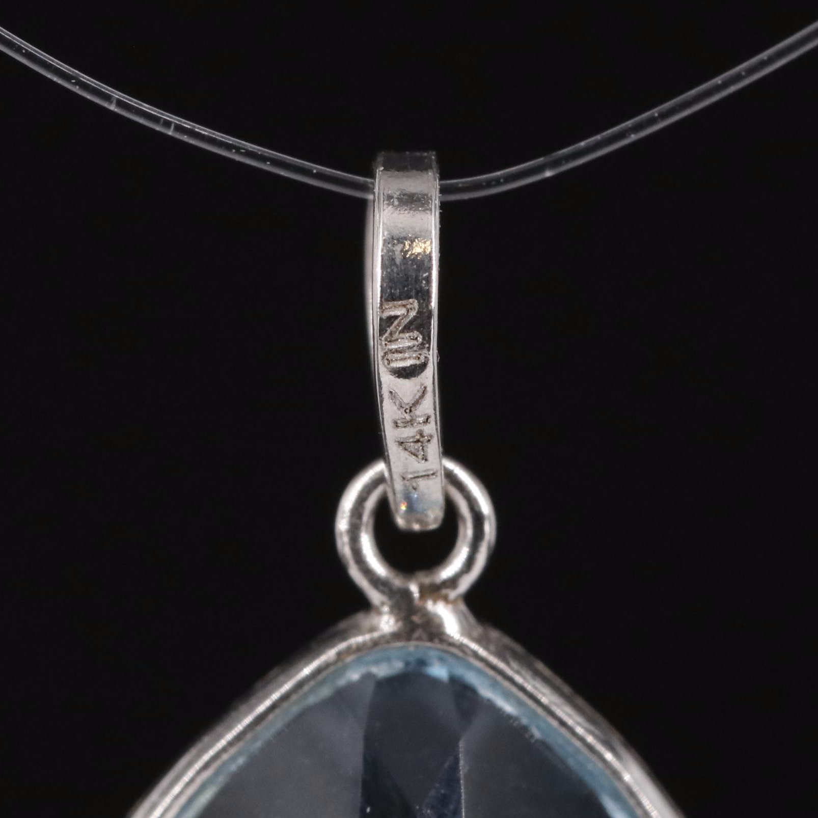 14K Blue Topaz Pendant