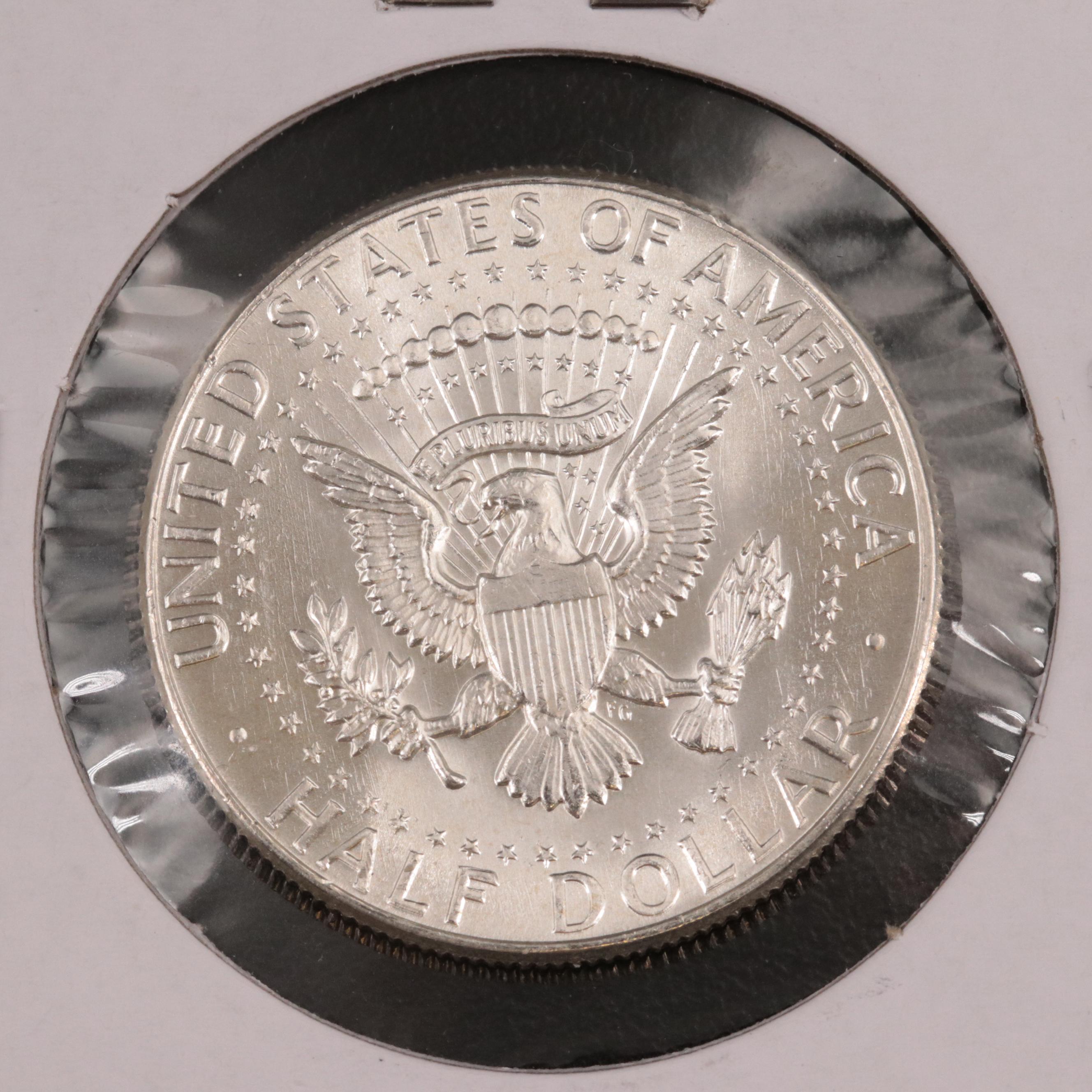 Two Uncirculated Silver Kennedy Half Dollars and 2010-D Hot Springs Quarter