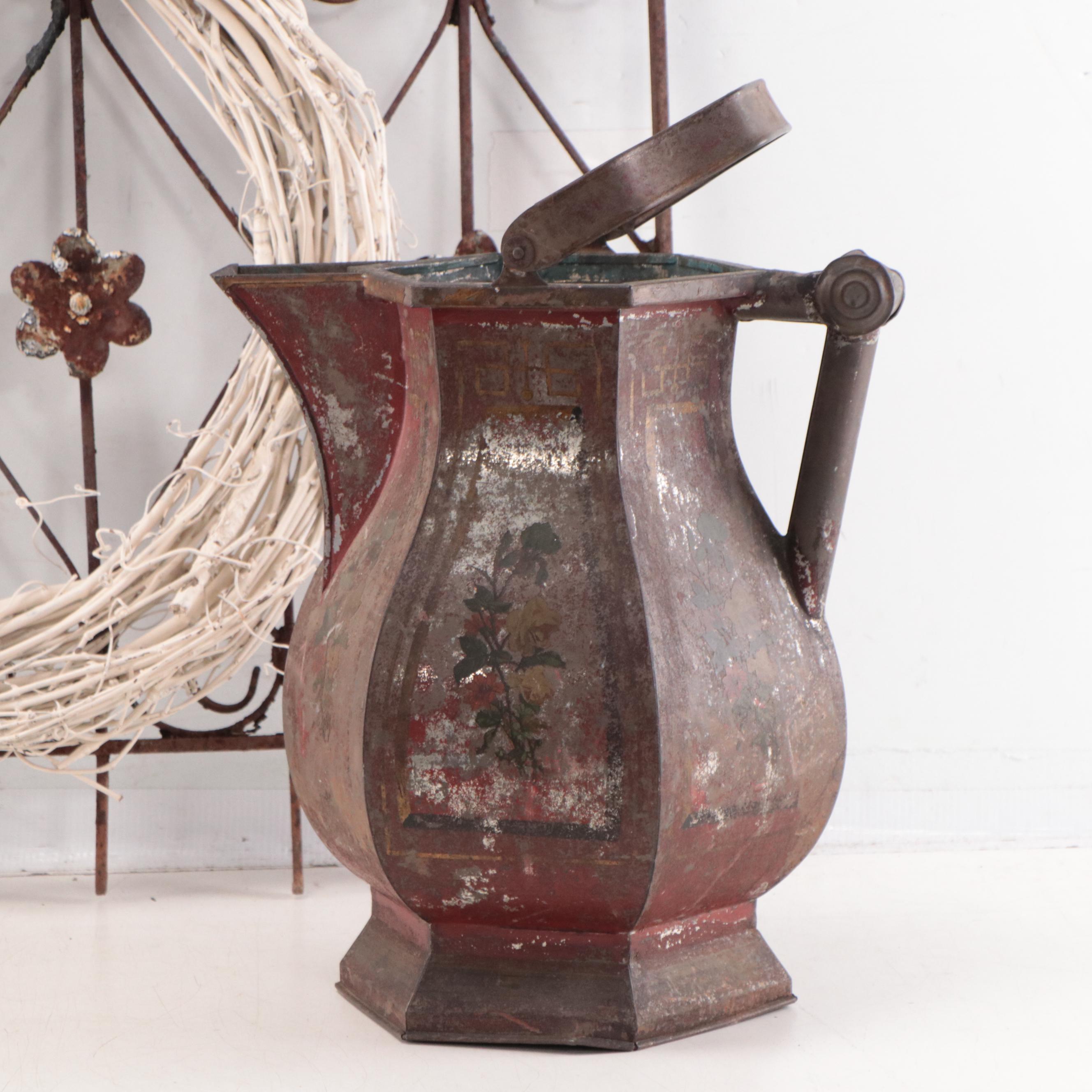 Wrought Iron Fencing With Wreath and Metal Pitcher