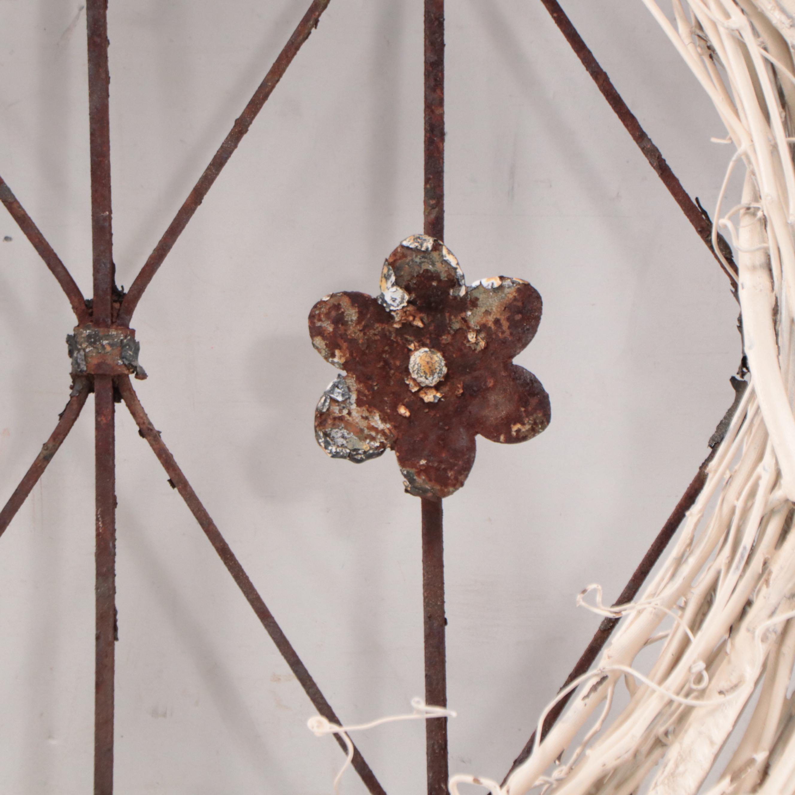 Wrought Iron Fencing With Wreath and Metal Pitcher