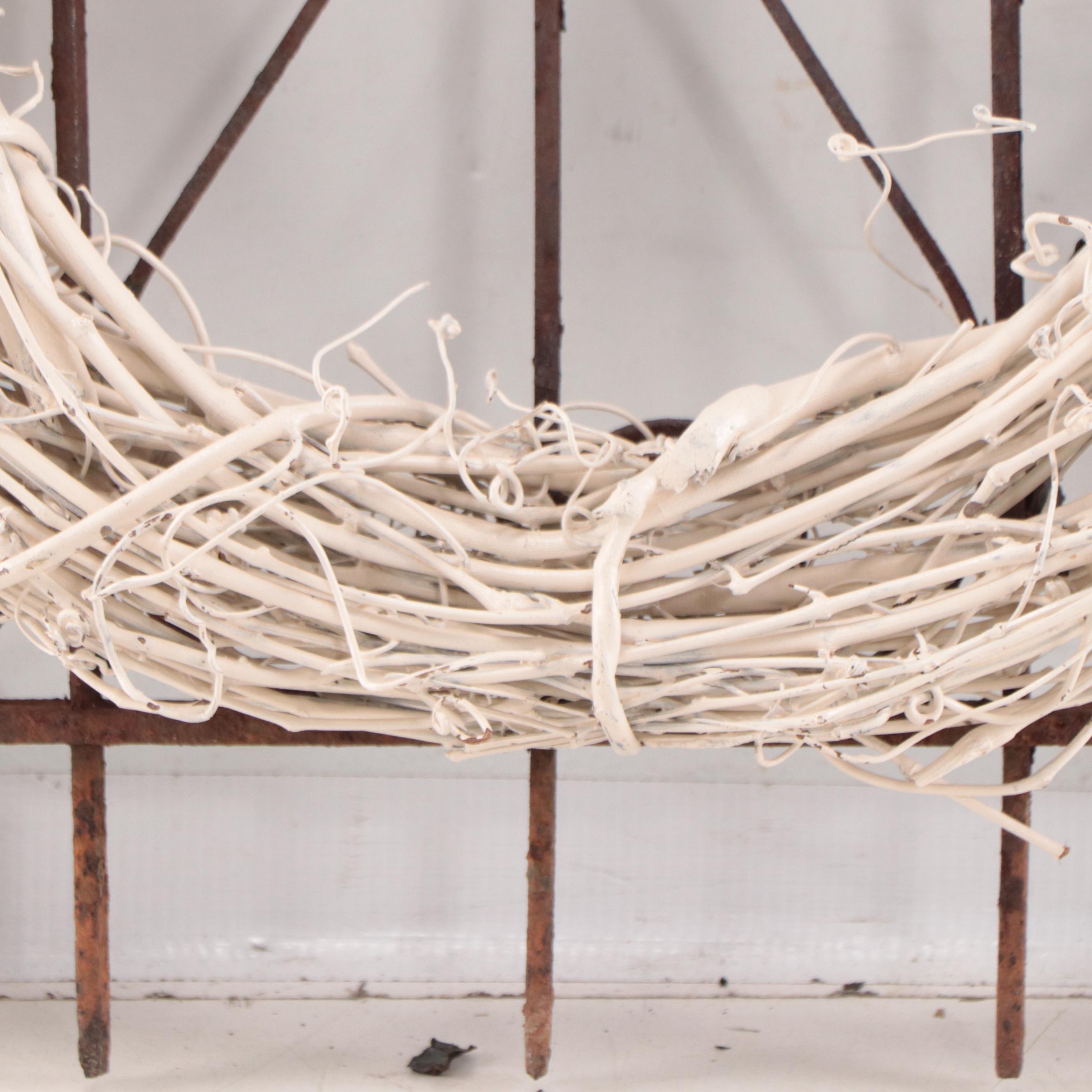 Wrought Iron Fencing With Wreath and Metal Pitcher