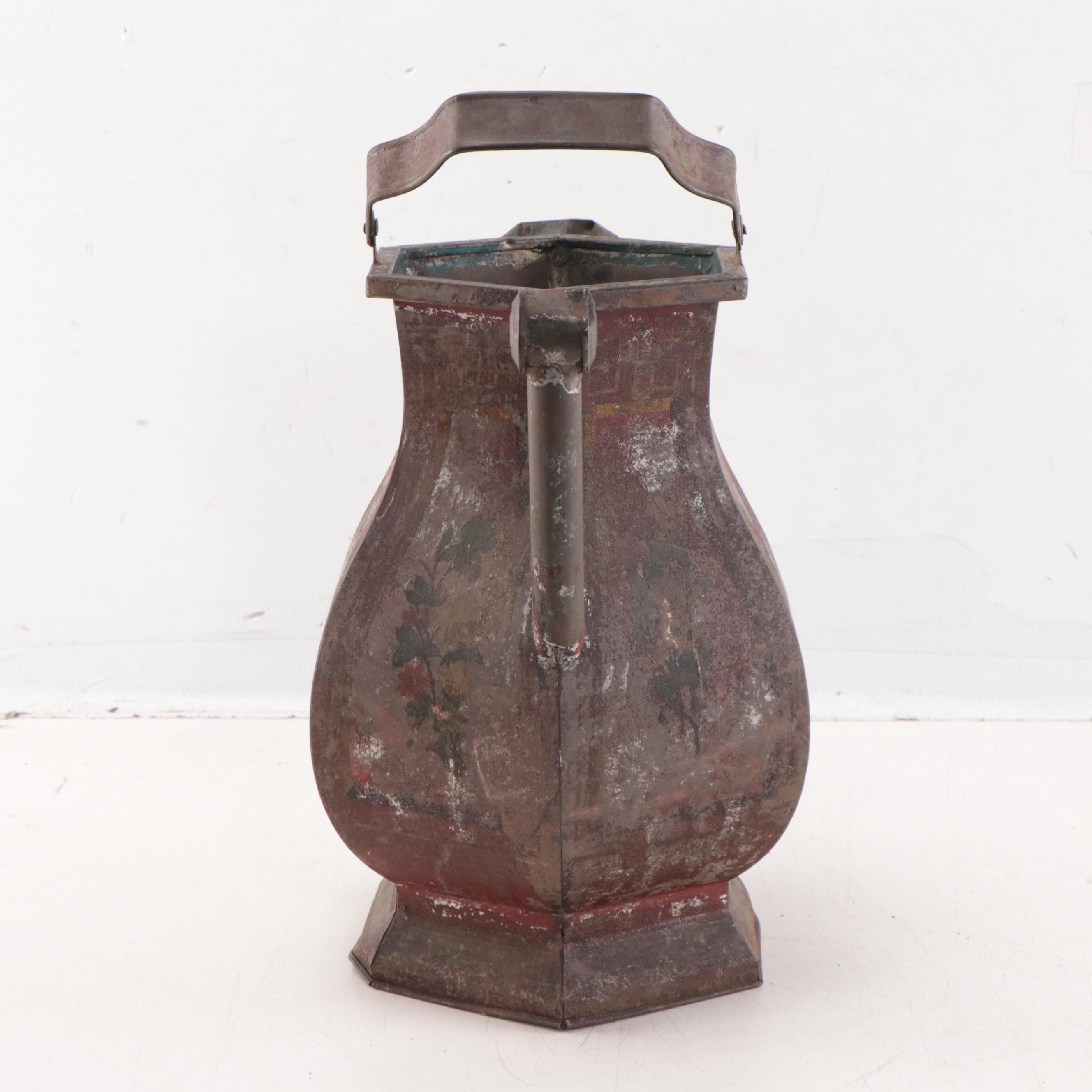 Wrought Iron Fencing With Wreath and Metal Pitcher