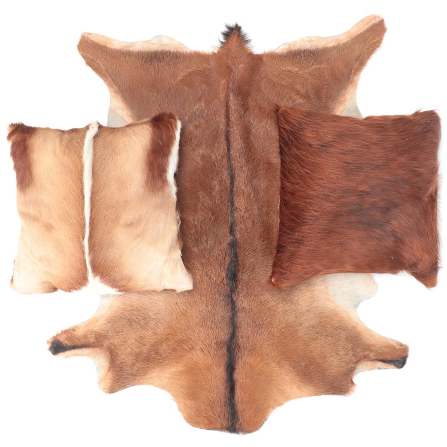 Goat and Springbok Pelt Accent Pillows and Grant's Gazelle Throw Rug