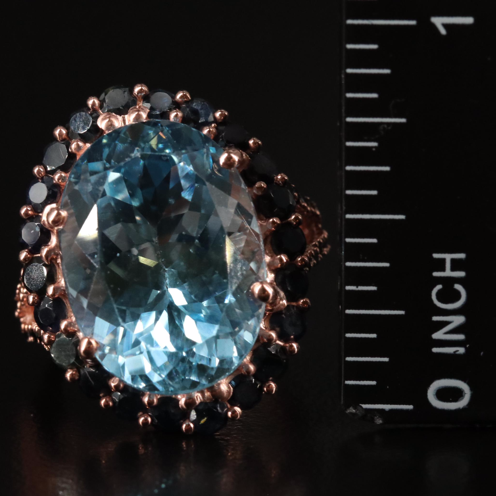 Sterling Blue Topaz and Sapphire Halo Ring