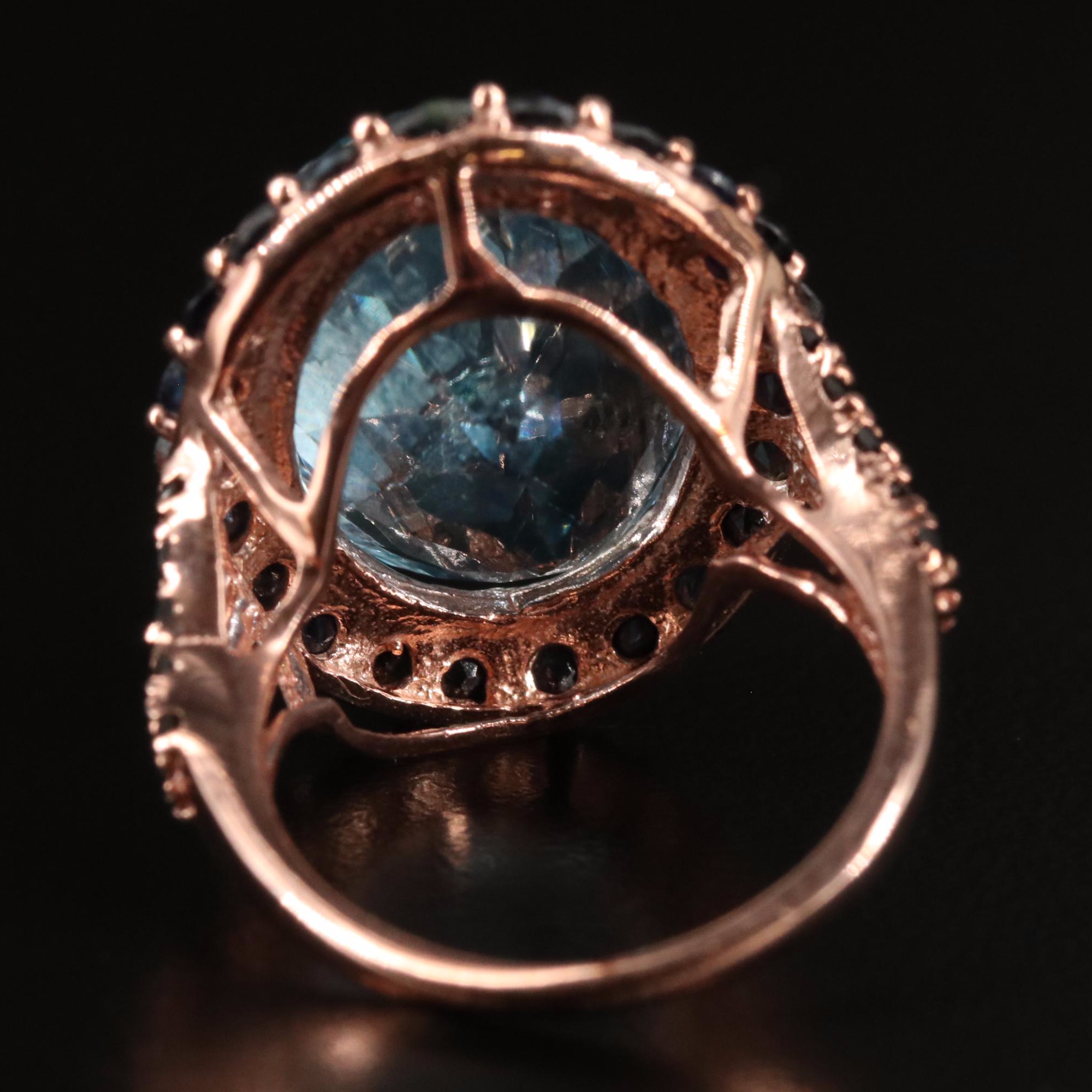 Sterling Blue Topaz and Sapphire Halo Ring