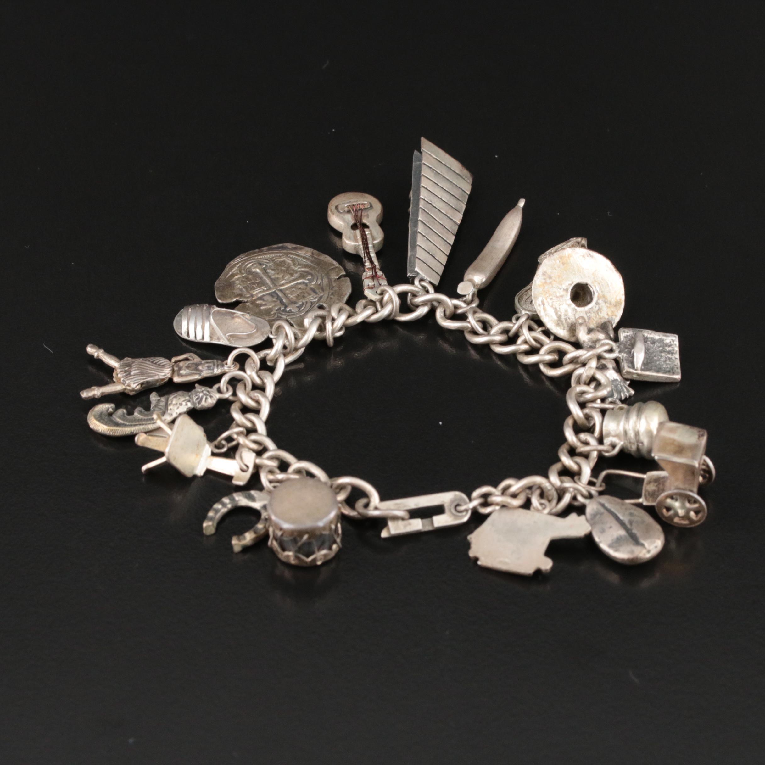 Sterling Articulating Charm Bracelet Including 800 Silver Charms