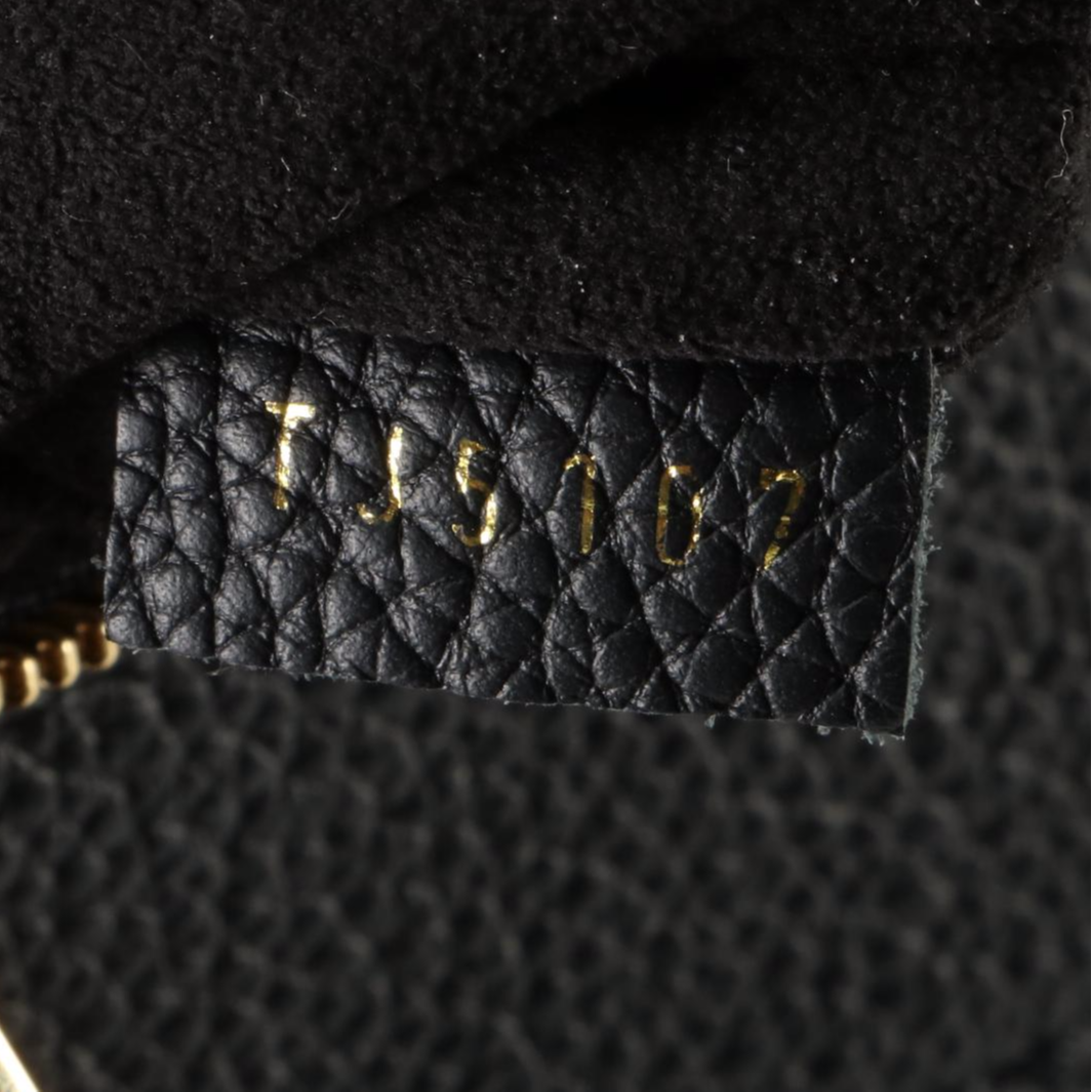 Louis Vuitton Freedom Handbag in Calfskin Leather with Shoulder Strap