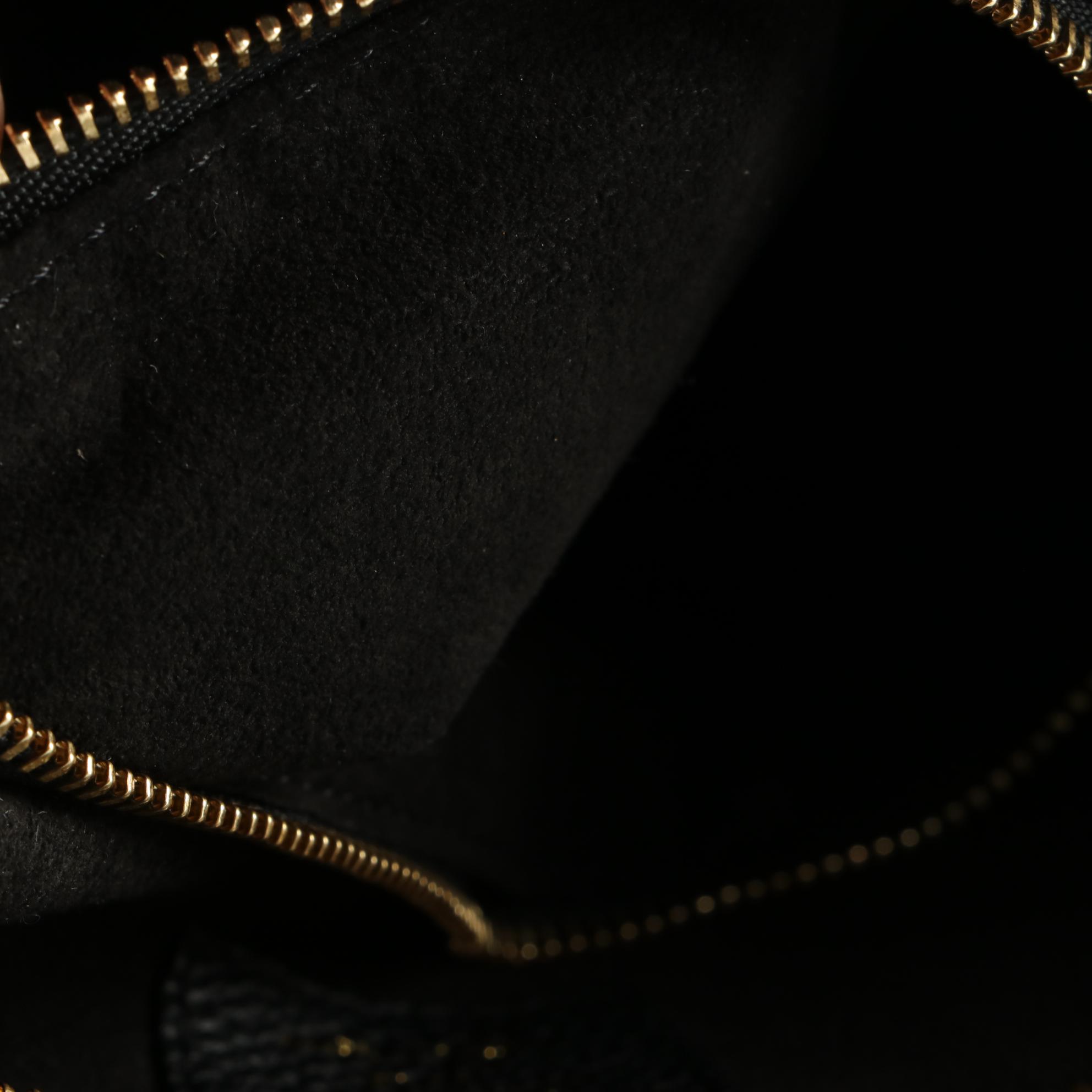 Louis Vuitton Freedom Handbag in Calfskin Leather with Shoulder Strap