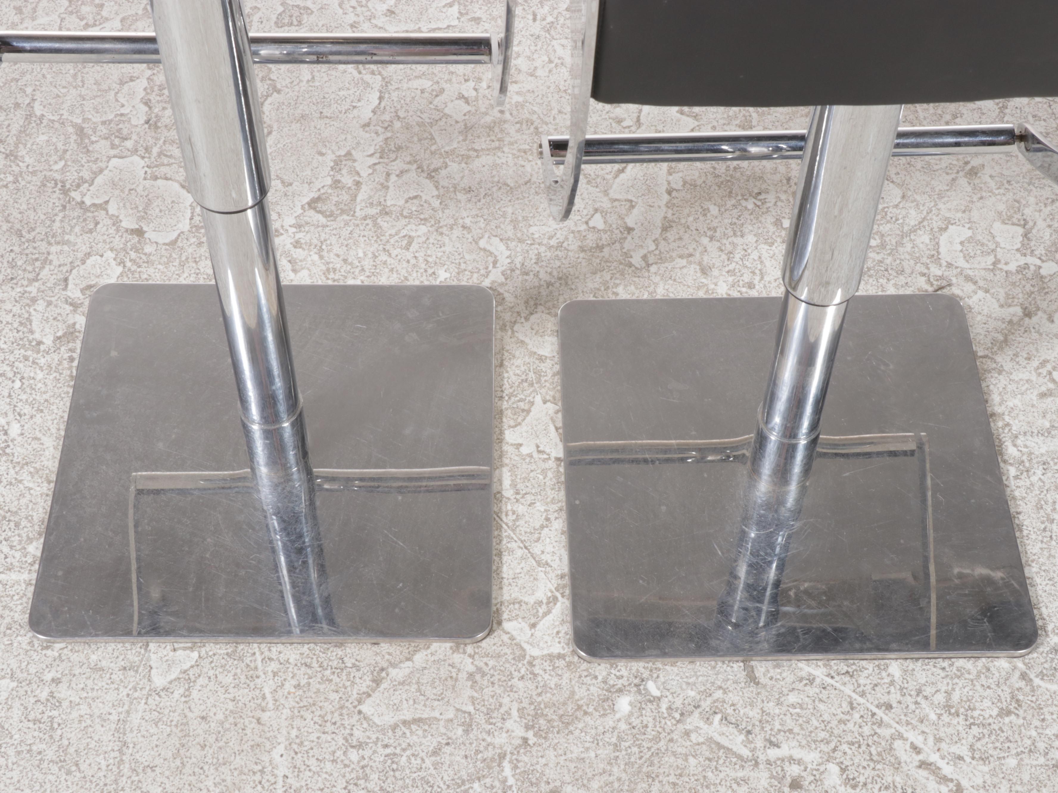 Pair of Nuevo "Swing" Chromed Steel and Naugahyde Adjustable-Height Bar Stools