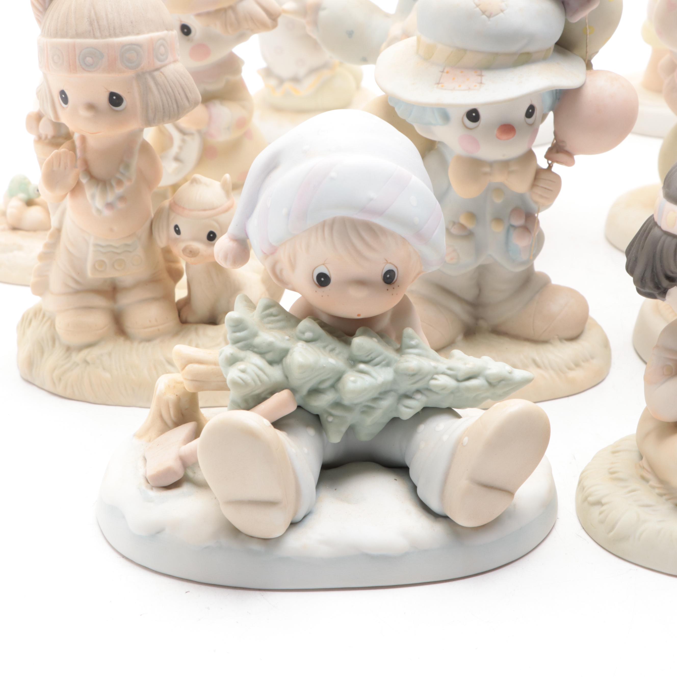 Precious Moments Porcelain Figurines Including "Put on a Happy Face" and More